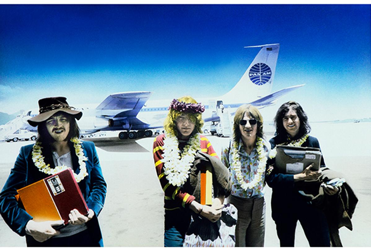 Signed limited edition print of Led Zeppelin by legendary rock photographer, Robert M Knight, taken in Hawaii at Honolulu airport on 12th May 1969, holding the master tapes to Led Zeppelin II.

C-Type print, size 30 x 40" - Limited edition number