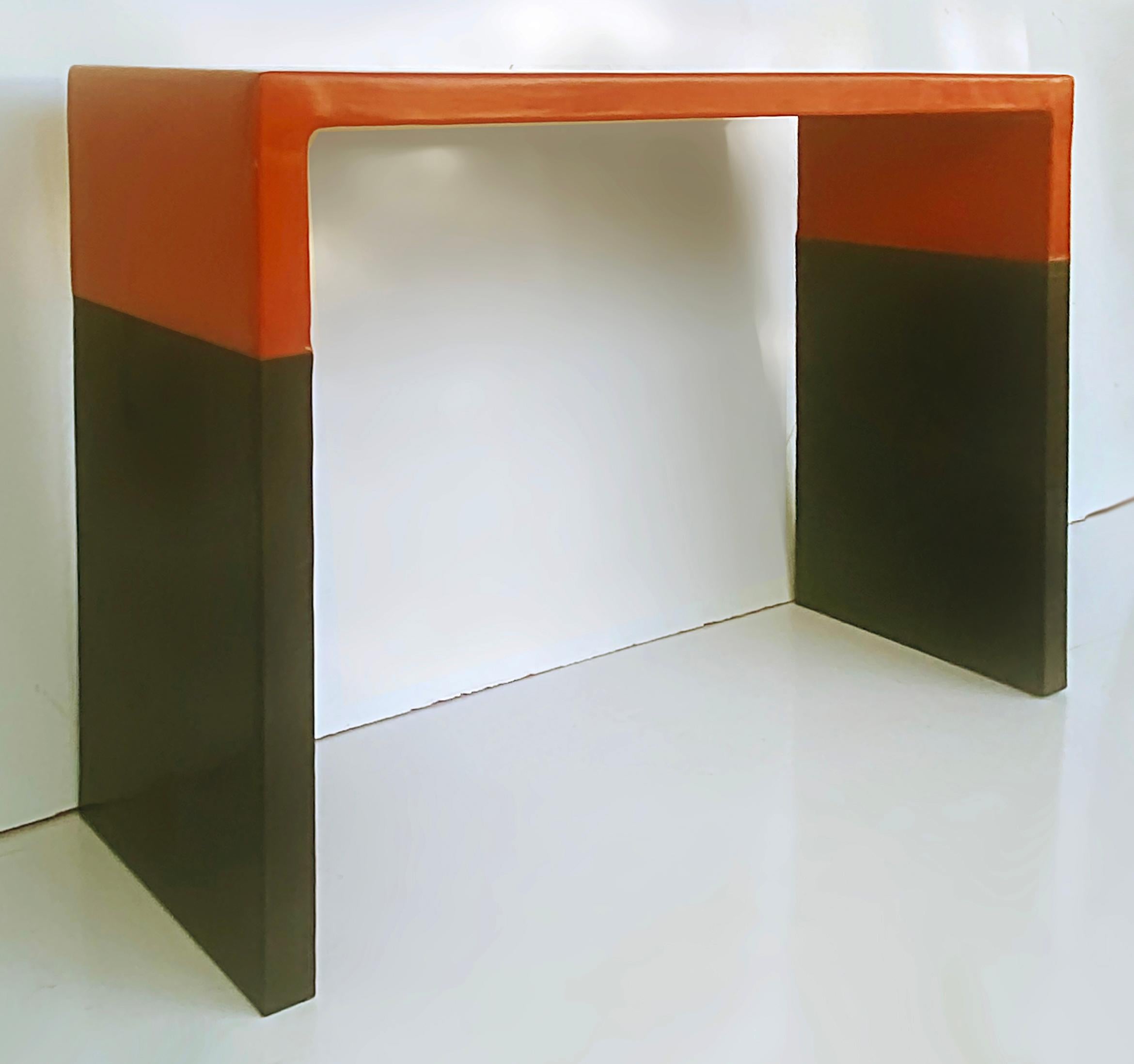 Robert Kuo Baker Furniture Lacquer, Copper Console Table, circa 2000

Offered for sale is a rare and important Robert Kuo design for Baker Furniture. This console parson's table is copper that has been lacquered in orange and was created circa