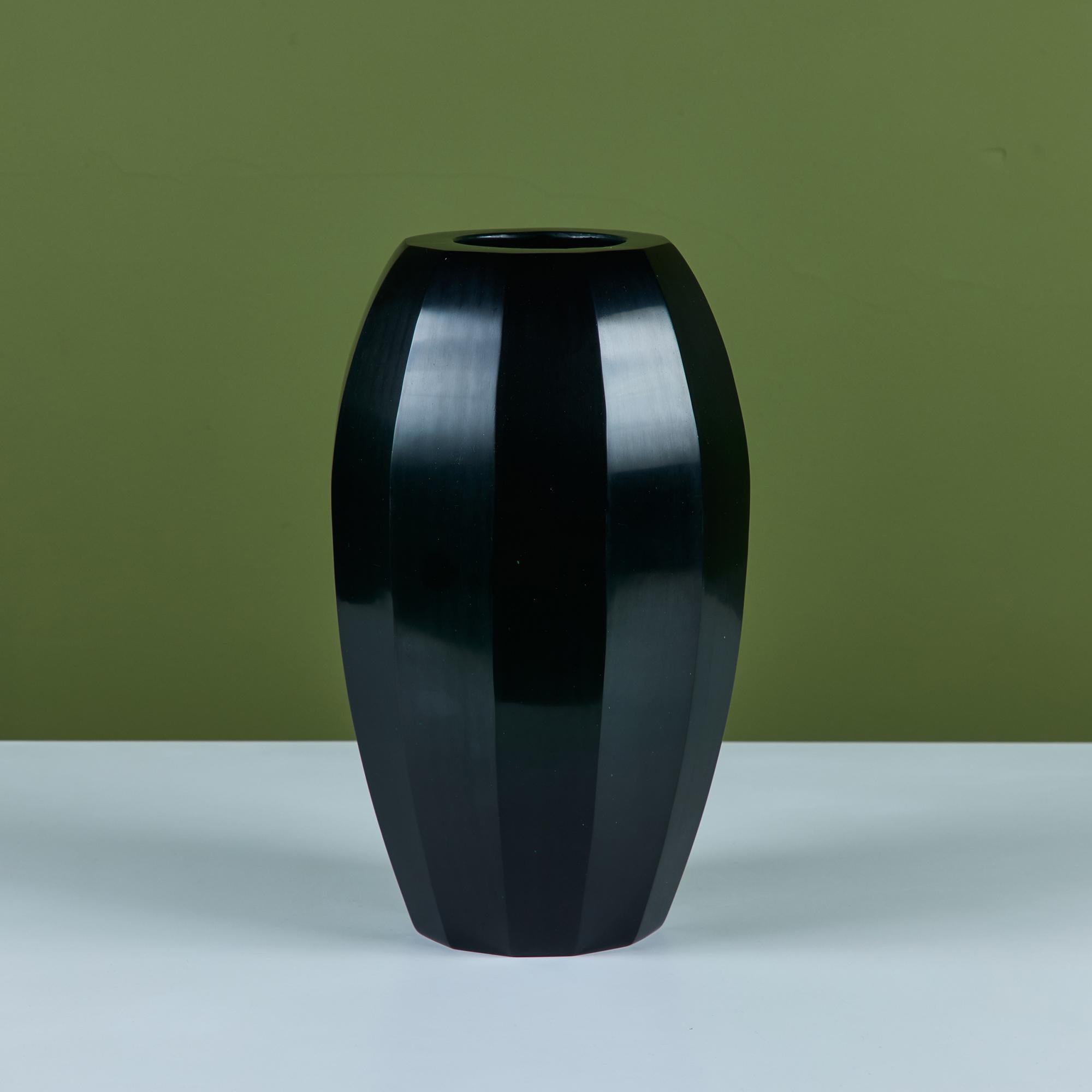 Hand blown glass vase by Robert Kuo, c.2000s, USA. The vase was produced using the peking glass method which originated in China. The dark green colored glass is blown into its form and then layered with more and more glass until the piece is