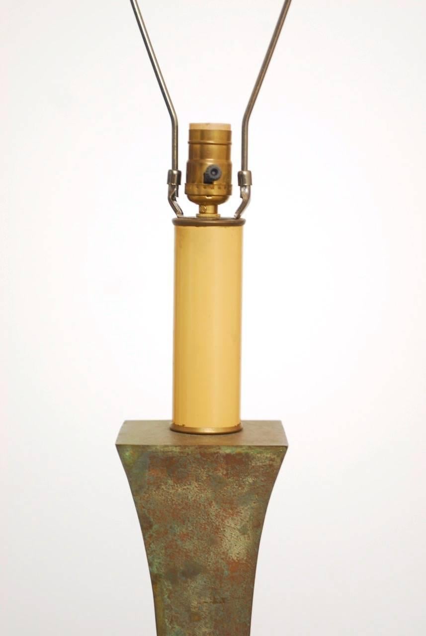 Intriguing Mcguire Organic Modern sculptural floor lamp featuring a patinated bronze finish. Features a large column flared on top and bottom mounted to a square wood plinth. Very heavy with a verdigris finish. Brass hardware and a vintage style