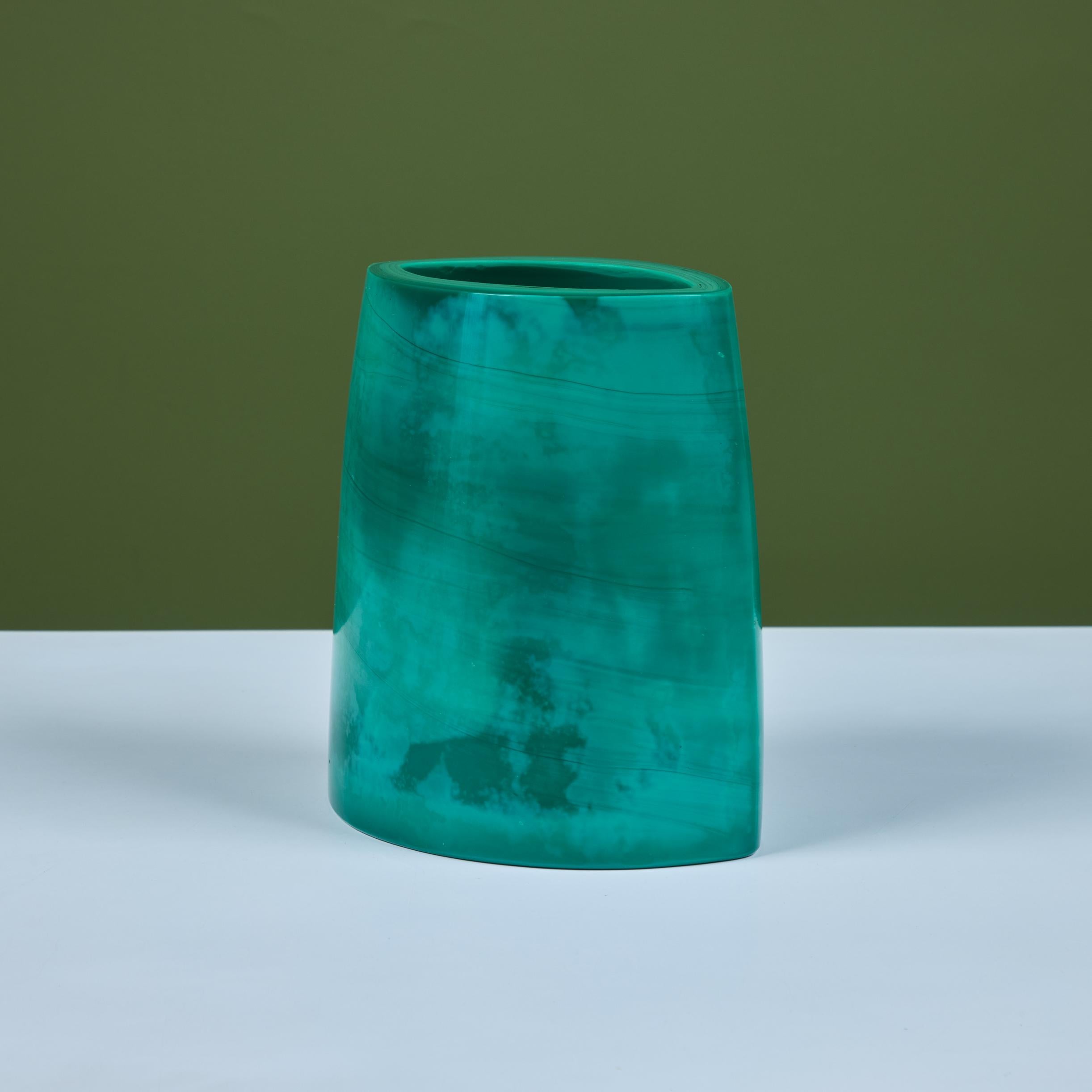 Hand blown glass vase by Robert Kuo, c.2000s, USA. The vase was produced using the peking glass method which originated in China. The green colored glass is blown into its form and then layered with more and more glass until the piece is completed.