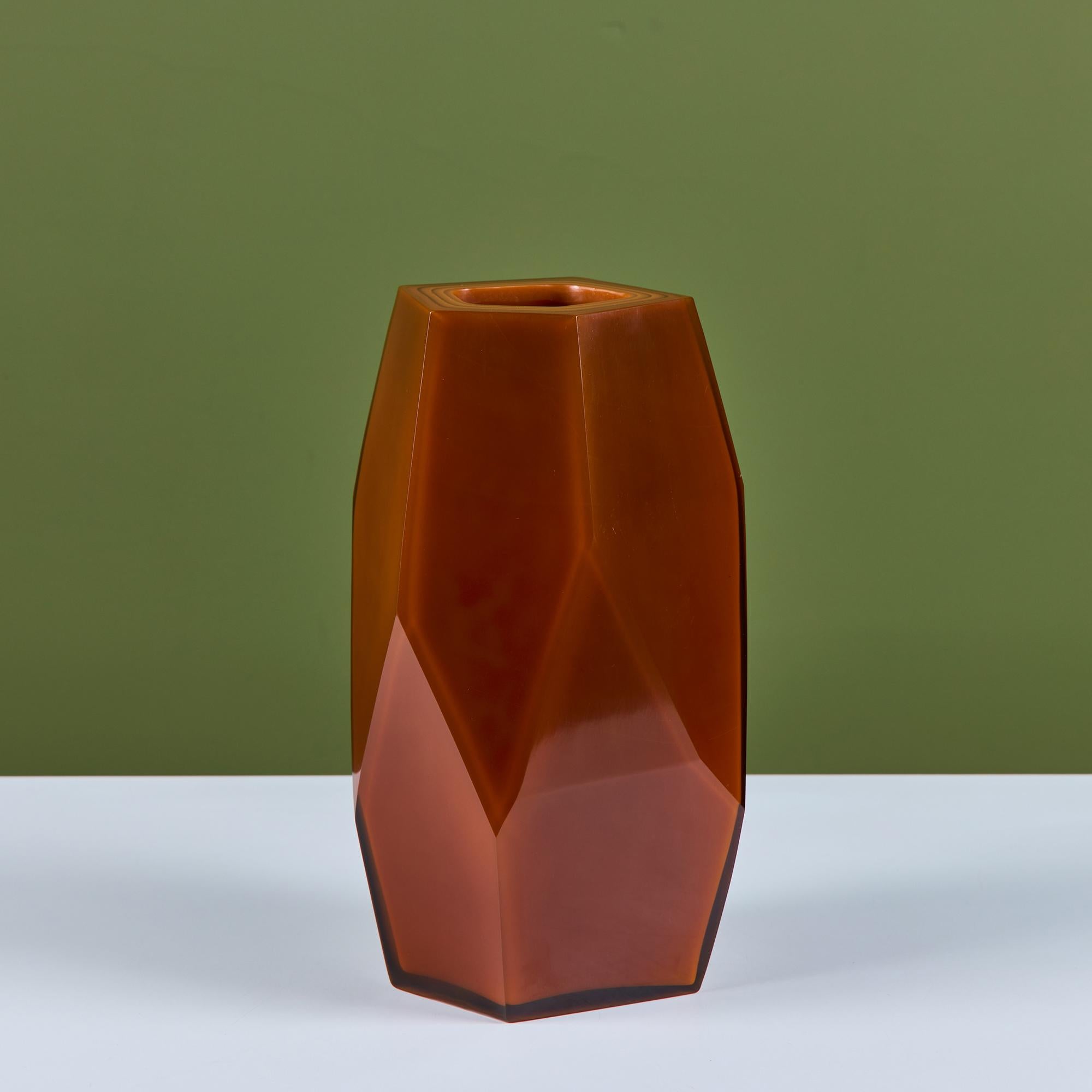 Hand blown glass faceted vase by Robert Kuo, c.2000s, USA. The vase was produced using the peking glass method which originated in China. The persimmon colored glass is blown into its form and then layered with more and more glass until the piece is