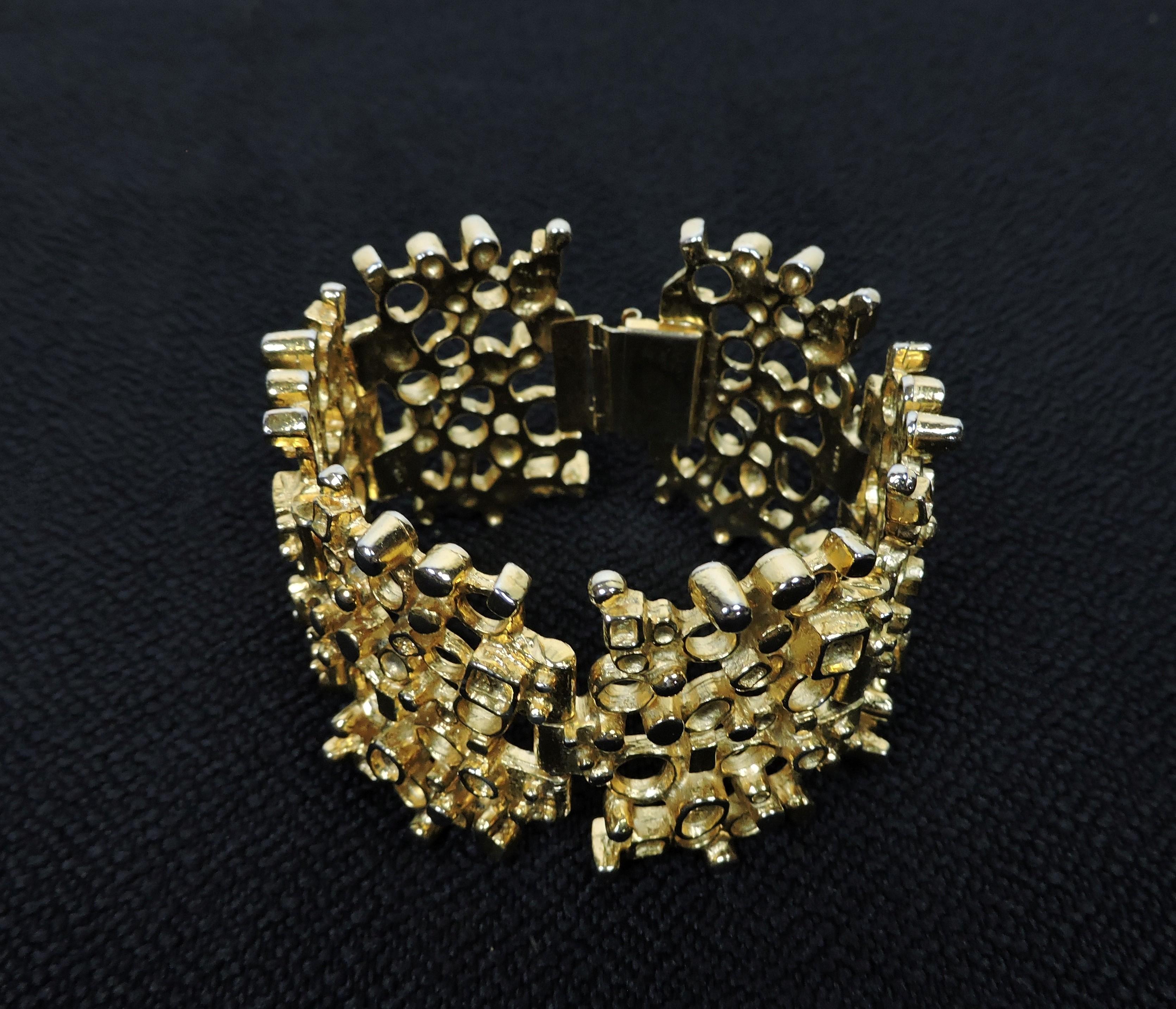 Striking and dramatic brutalist style sculptural gold tone bracelet by acclaimed Canadian jewelry artist, Robert Larin. The dimension when closed is 3.75 inches diameter. Made of hand cast pewter and signed RLA, for Robert Larin Atelier, on the