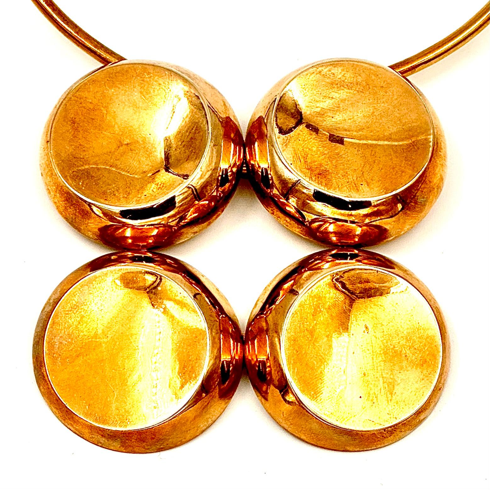 This striking and powerful statement necklace is made of polished brass. The high polish makes this look like a massive solid gold necklace, which is the ultimate fashion jewelry trick. Fun, Bold and commanding, the woman who wears this is a strong
