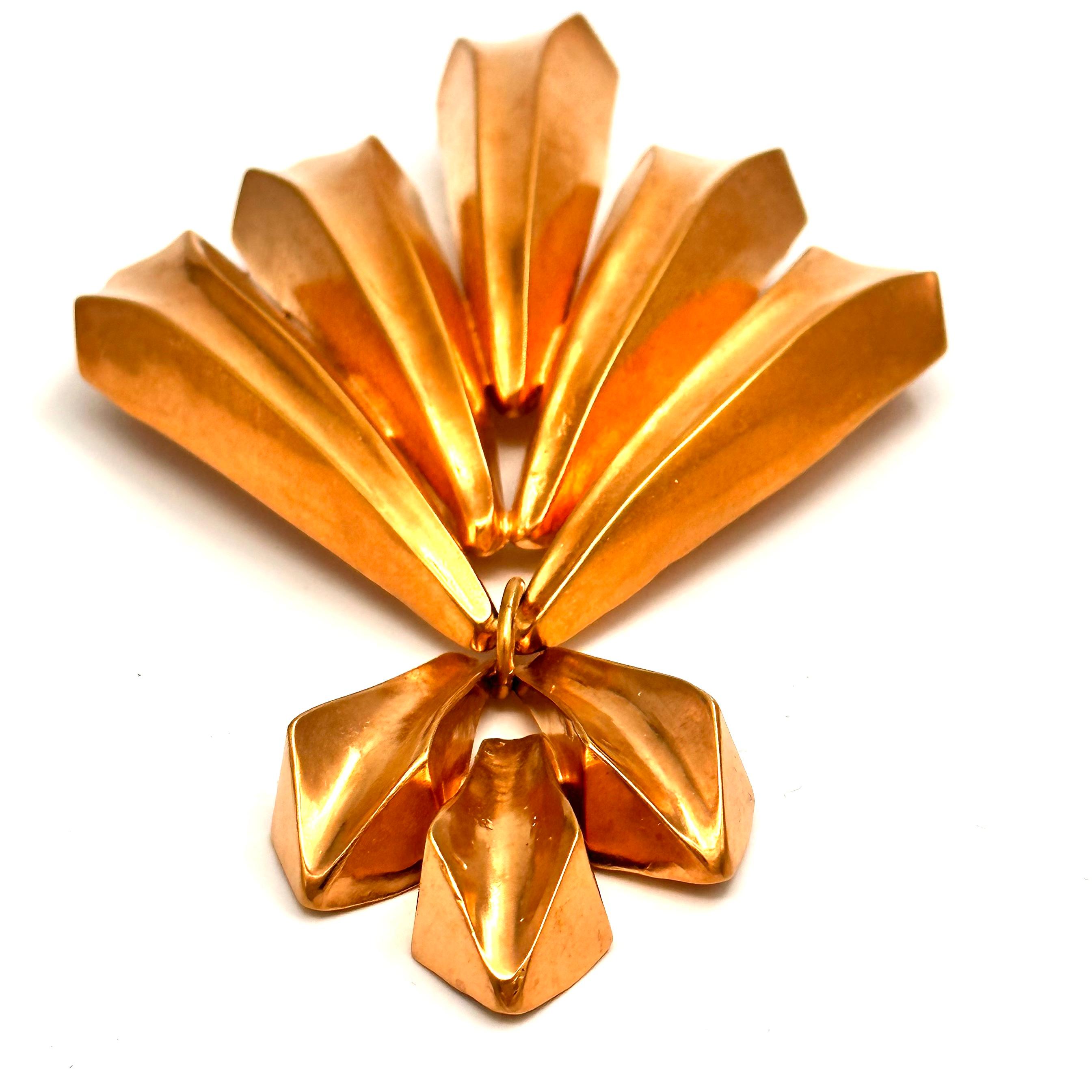 Created in the late 1980's for Donna Karan, Robert Lee Morris made this two part and very large brooch. The larger top resembles 5 jets flying in formation like the Blue Angels, and the hanging smaller bottom spray is a delightful and unexpected
