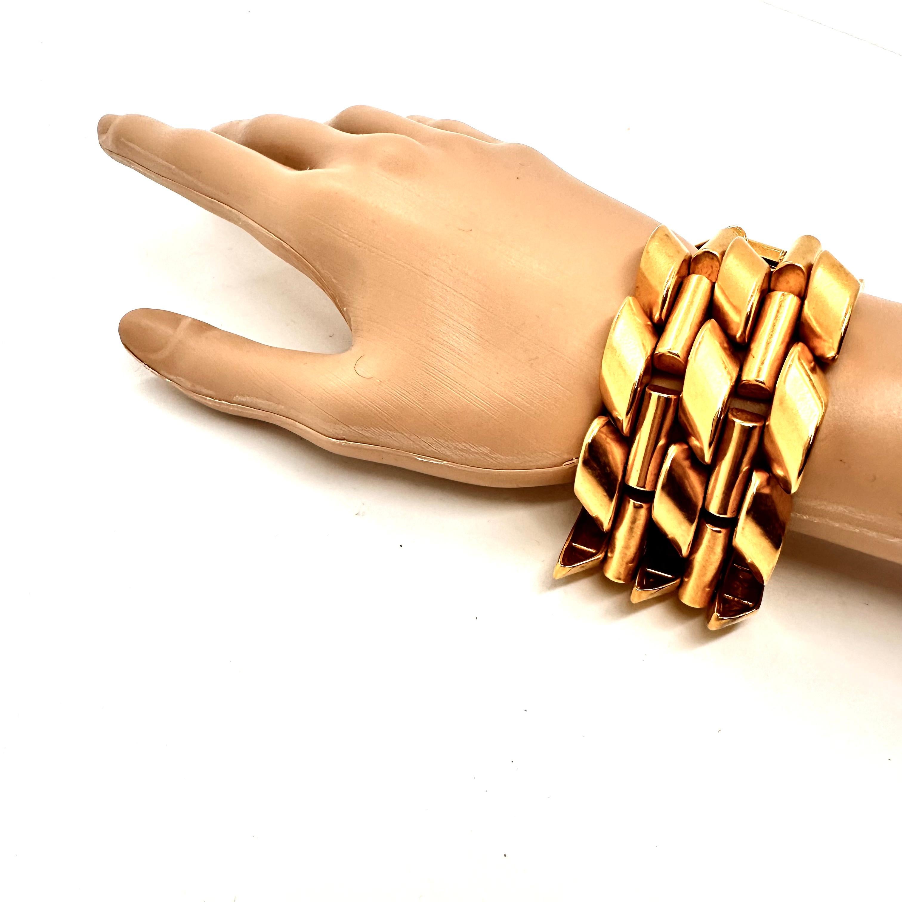 Robert Lee Morris loved to mix architectural and organic elements, and this wide luxurious GOLD plated brass link is rich with mechanical shapes,  herringbone woven with rounded bars. He makes sculptural art/fashion jewelry that is both sensually