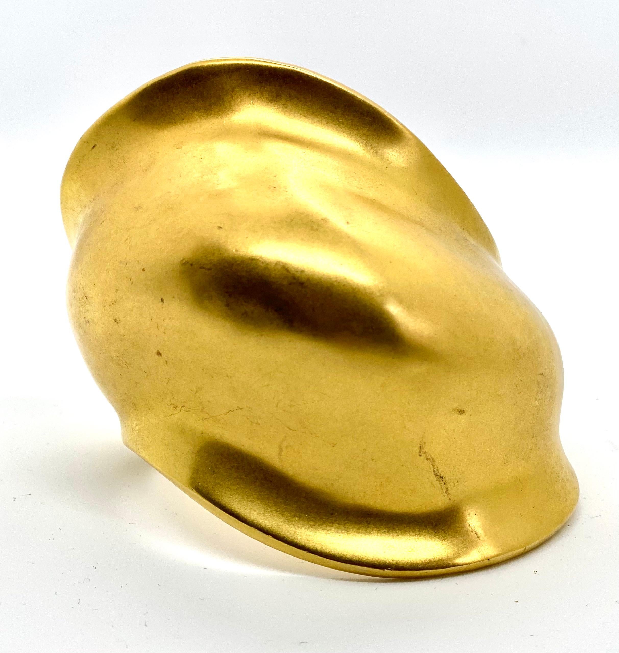 This iconic sculptural design by Robert Lee Morris, was created originally in 1977, and is a dramatic organic cuff bracelet. Electroplated in a matte 24k gold, over brass, this is a handmade piece that is the last one available. This full blown,