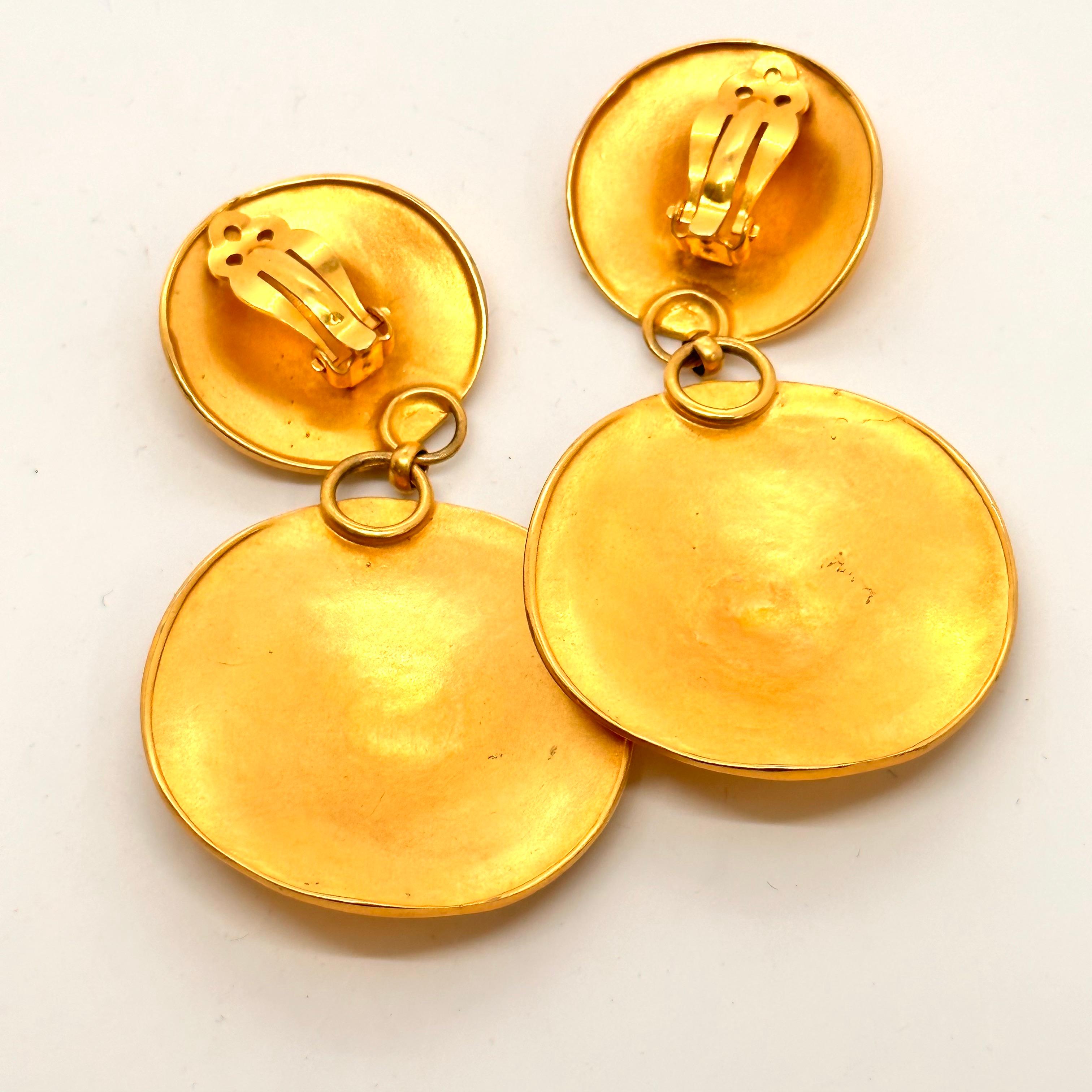 Very Iconic BOLD GOLD earrings from the decade of decadence, the 1980's. This pair of very recognizable Robert Lee Morris glamorous gold earrings are runway ready. The signature discs that define the organic quality of RLM jewelry are 3.25