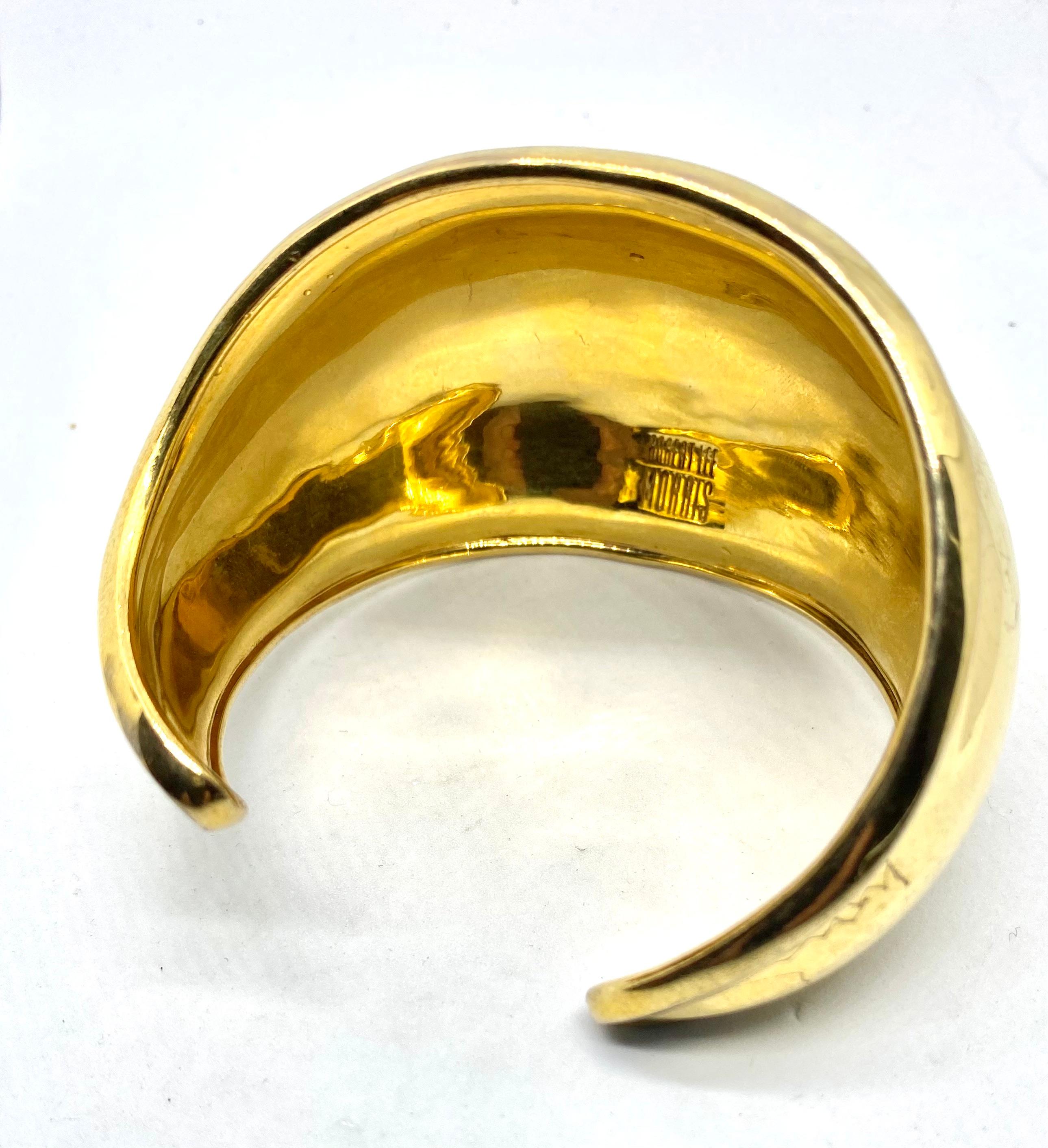 This is one of the most loved and wearable matte gold plated brass cuffs in the entire range of Robert Lee Morris bracelets. Created in the mid 1970's and named small Beta Cuff, due to its twisting form, this piece is one of his most popular. Easy