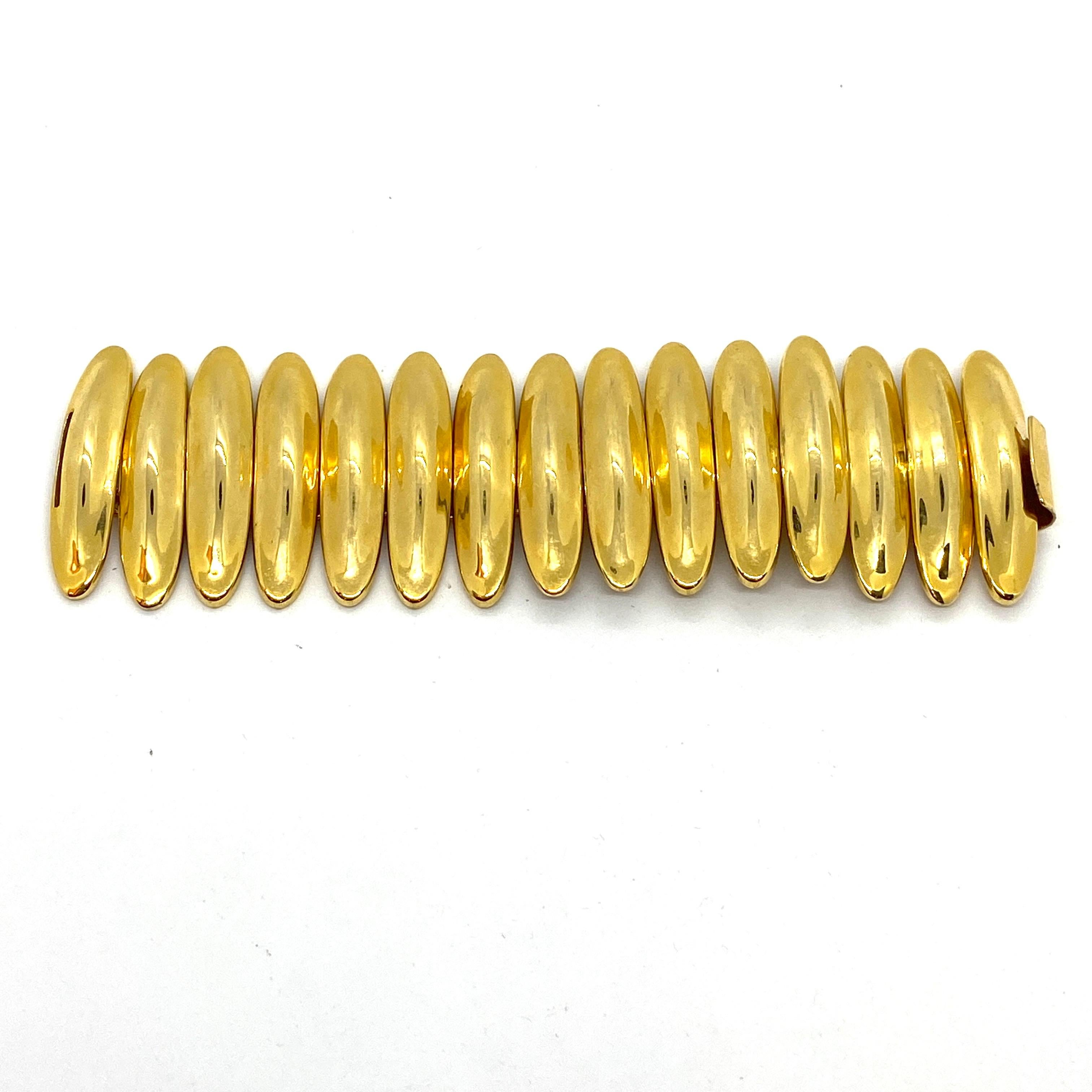 The Robert Lee Morris Caterpillar bracelet is a shiny 18k gold plated brass link construction that is very fluid, flexible and very comfortable to wear. The width of the gleaming golden bracelet is wide at 2.25