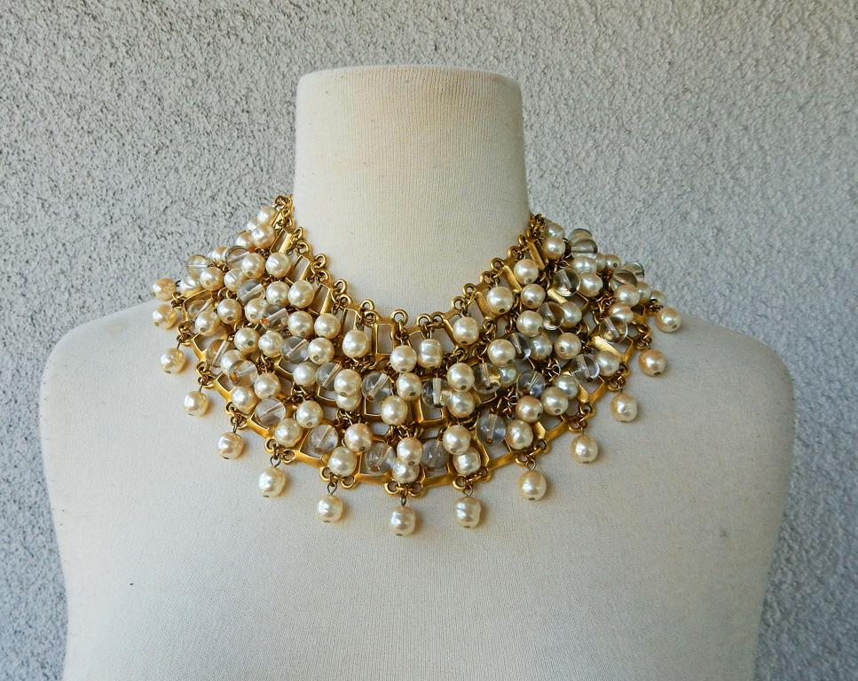 Circa 1980's-90's dramatic very well made Robert Lee Morris choker.  Features faux white pearl and resin interspersed with gold metal.  A strong statement piece and unique necklace often not seen in RLM current vintage fashion jewelry.  Necklace is