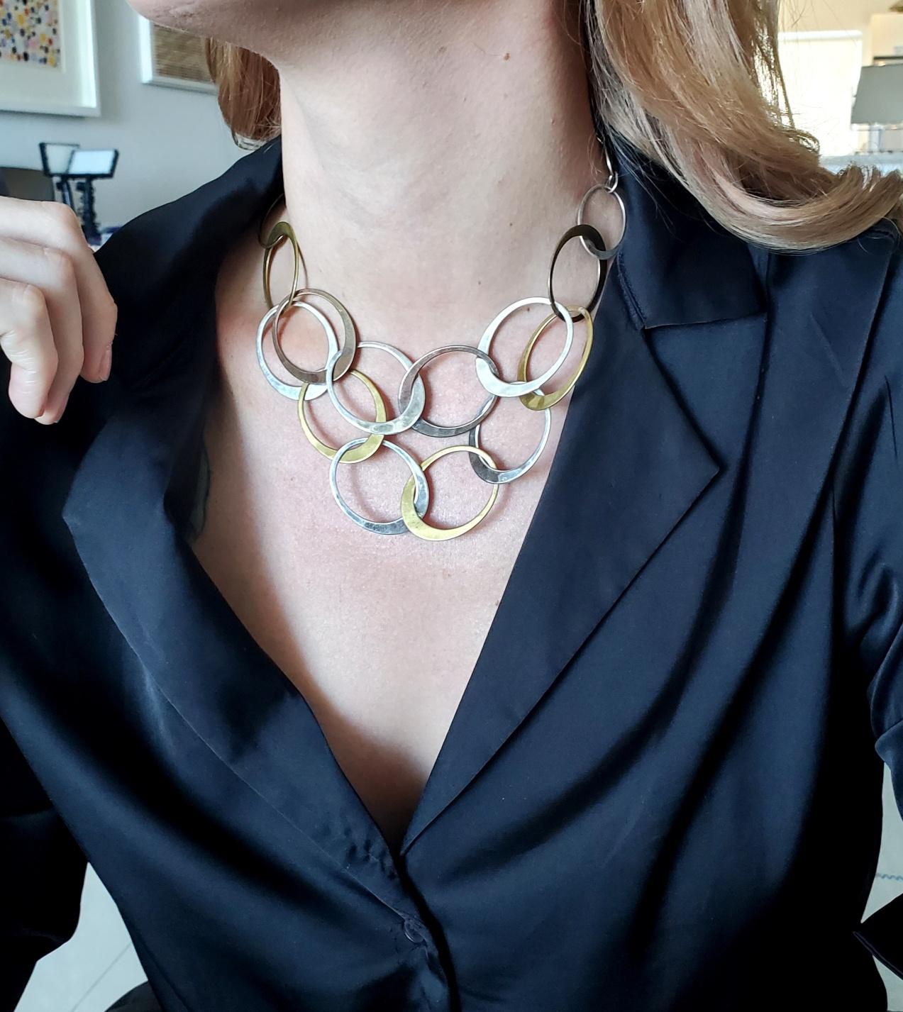 A tri color links necklace designed by Robert Lee Morris.

Beautiful modernist necklace, created at the studio of Robert Lee Morris, back in the 1970's. This geometric necklace has been crafted with diverse oval elements of different sizes