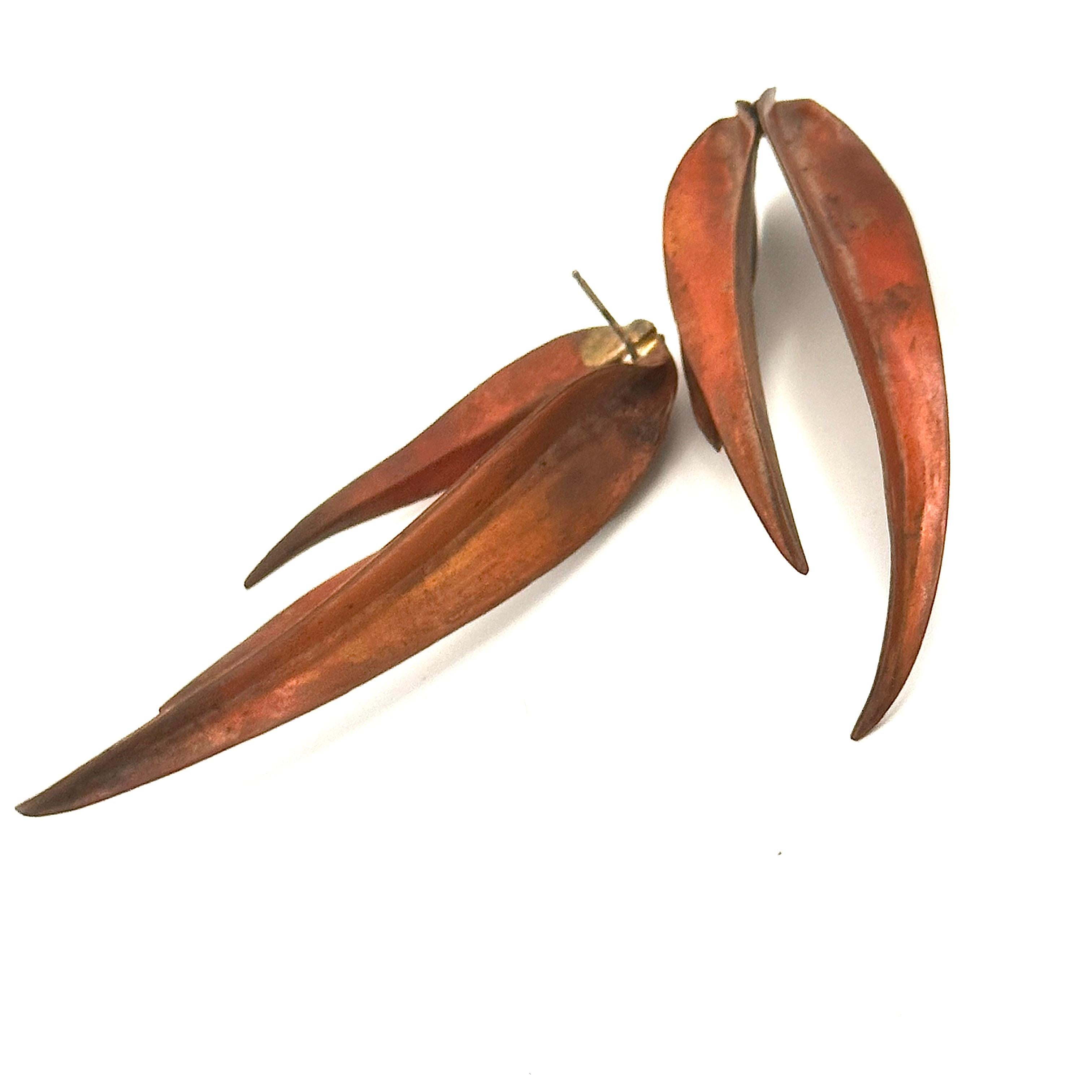 One of the superstar pieces of jewelry Robert Lee Morris created for Calvin Klein's fall 1981 runway show. The theme of long blades of grass, in matte 24k gold and ruddy red copper, or darkened brass. These iconic earrings capture the essence of the