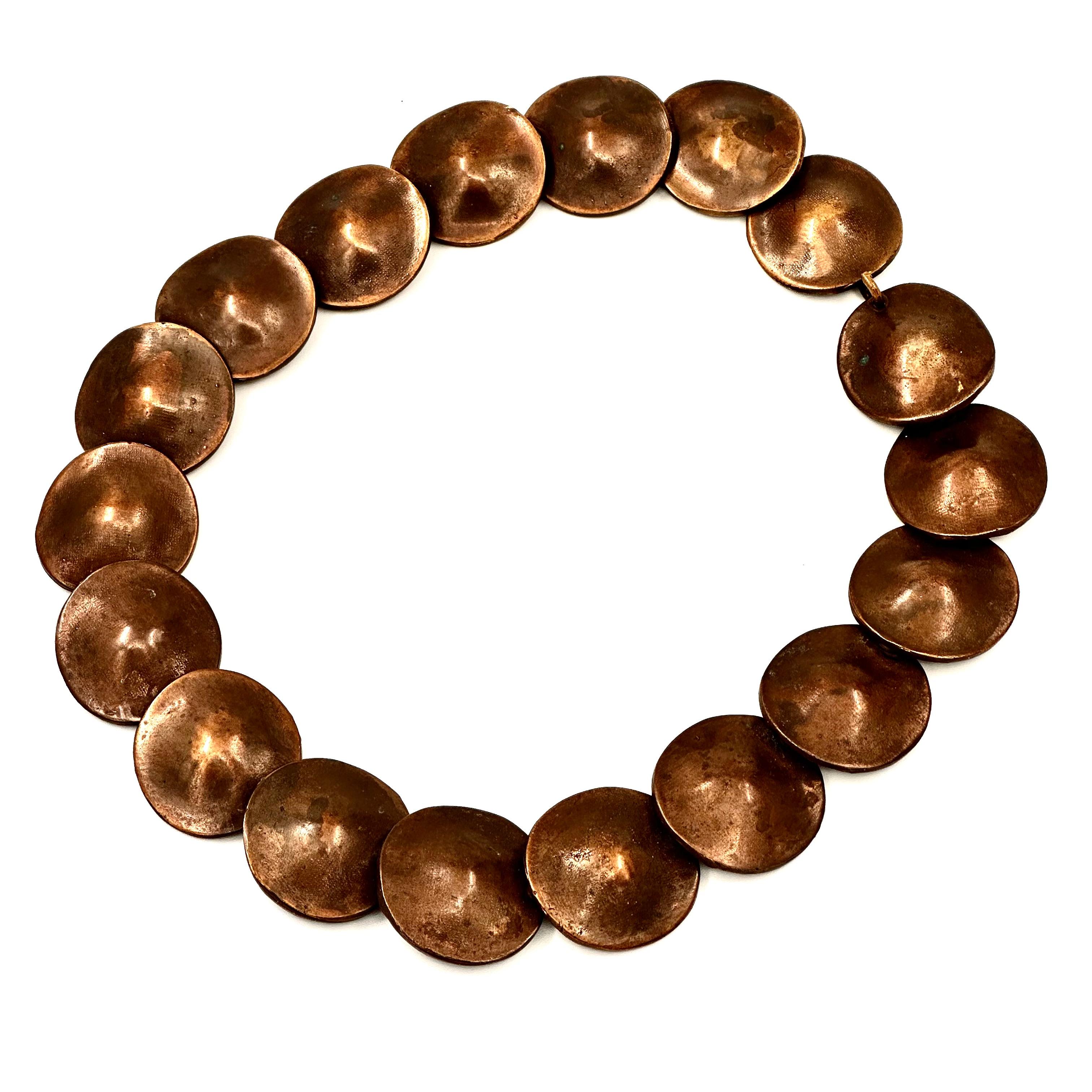 Created in 1981 for the Calvin Klein fall collection, this is an oxidized brass disc belt, iconic Robert Lee Morris form, with a Wabi Sabi coloration and finish. It is basically a brownish bronze color, so chic and understated but dramatic as can