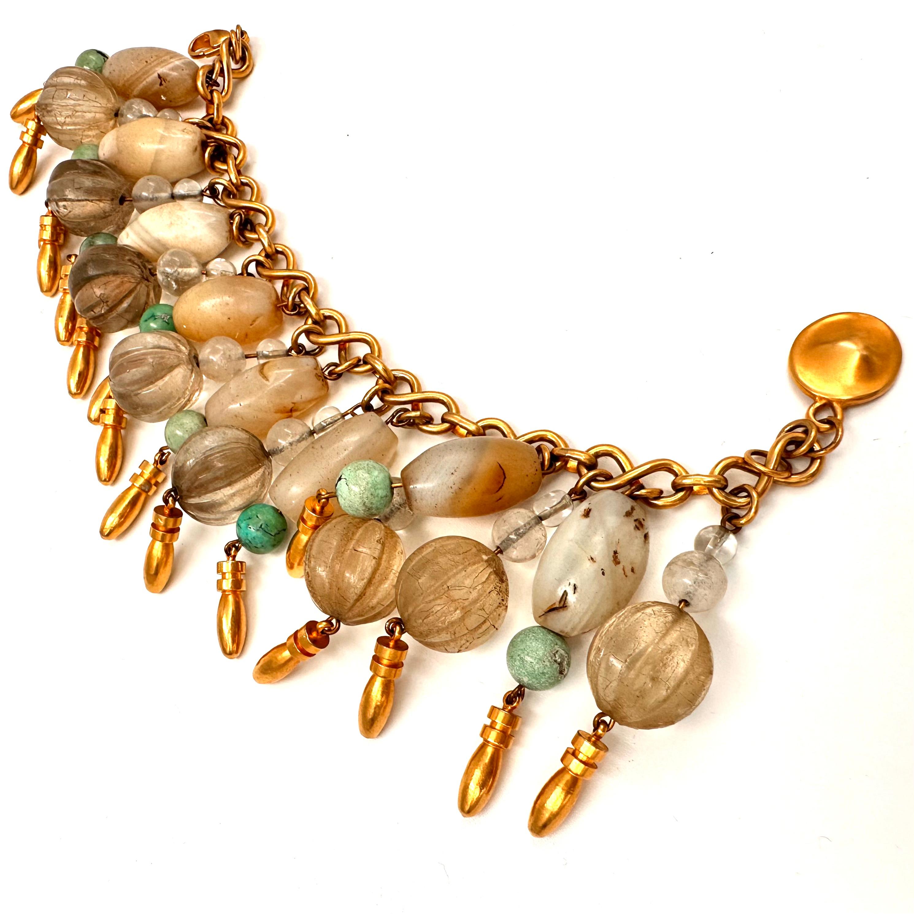 Robert Lee Morris Wabi Sabi Stone Charm Bracelet made in 1984 is a One of a Kind. It is a blend of vintage African trading beads, made of agate and quartz stone, with molded glass beads, turquoise and crystal all hanging on a brass eternity chain