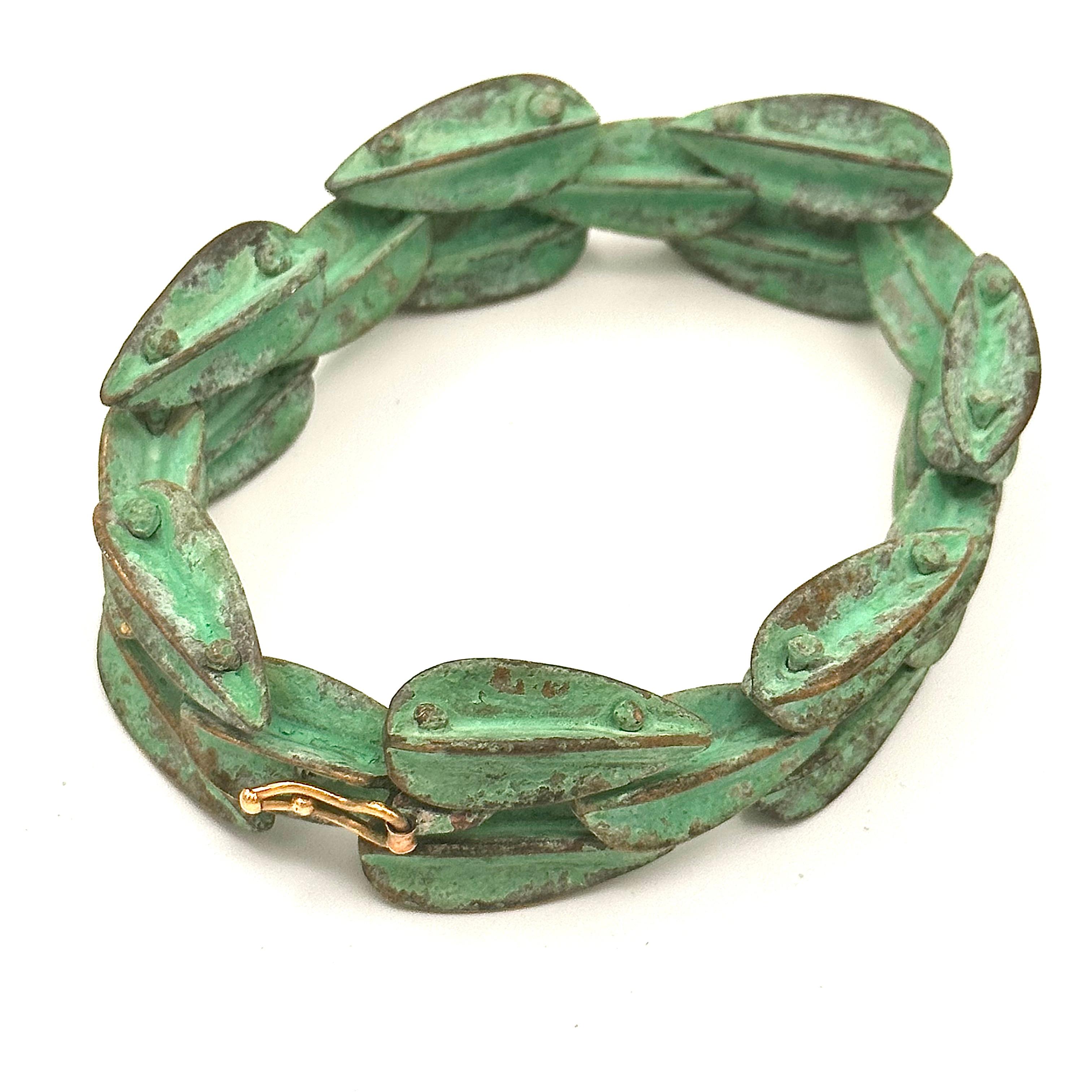 An iconic bracelet by Robert Lee Morris from 1982, of brass Dart castings that are riveted in a 2x1 configuration is in stunning green verdigris, a very Wabi Sabi finish. The edges of the Darts will show wear while the inside areas stay bright green