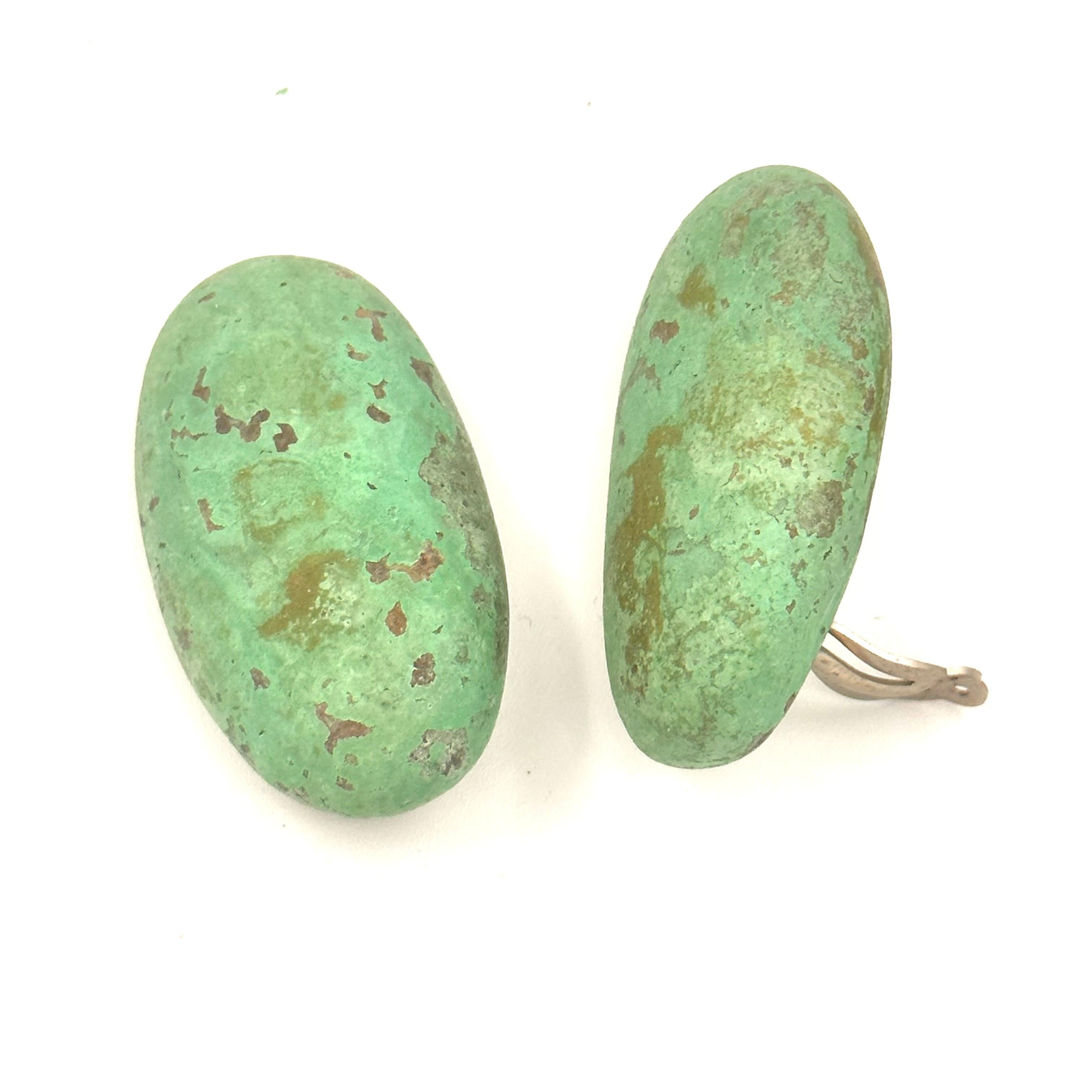 The Wabi Sabi theme of soft pebbles, gives way to many Verdigris earrings which were a ground breaking color for jewelry that Robert Lee Morris launched in 1981 with Calvin Klein. These oversized dramatic and very sculptural oxidized brass earrings