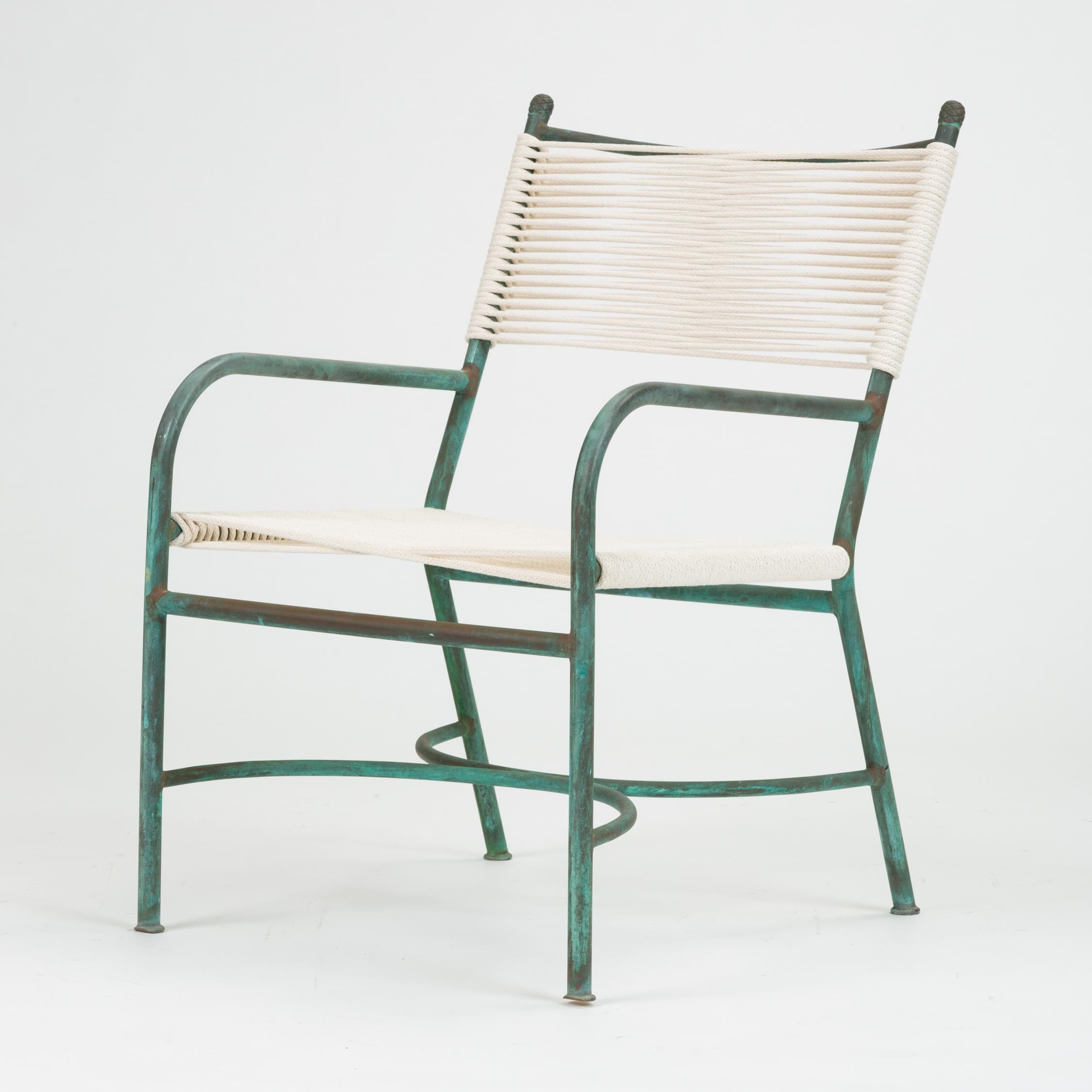 An early California-made bronze patio lounge chair by Walter Lamb antecedent, Robert Lewis. The bronze tubing in this example is very slender, sculpted into a chair with an angled backrest, comparatively low-set arms, and the C-shaped supports that
