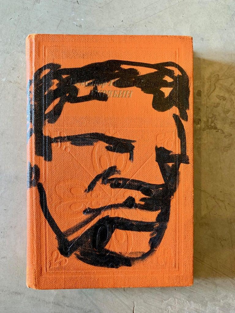 Fantastic original drawing by Robert Loughlin on an old orange book. Looks to be an old Russian book. Orange book with black drawing of 'the Brute' on the cover. Signed RL and dated 2003 on the back cover. Multiple Robert Loughlin originals