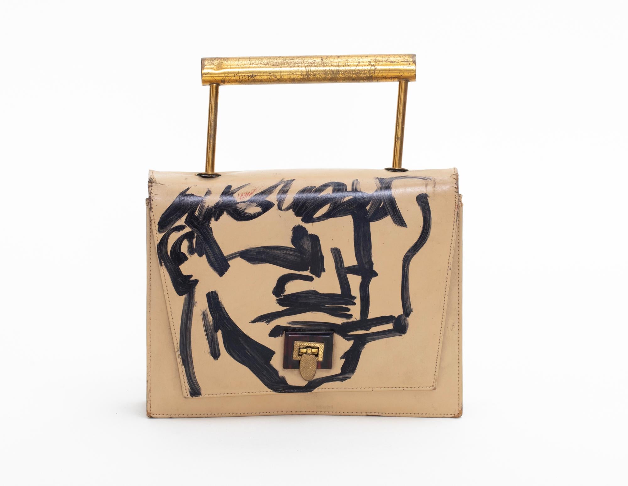 Paint on found leather purse by New York City picking and art legend, Robert Loughlin. “DEVO’” painted on the back. Featured in Patrick Parrish Gallery's “Robert Loughlin: 1998-2011” exhibition in 2021.

ROBERT LOUGHLIN (1949 - 2011) may have been