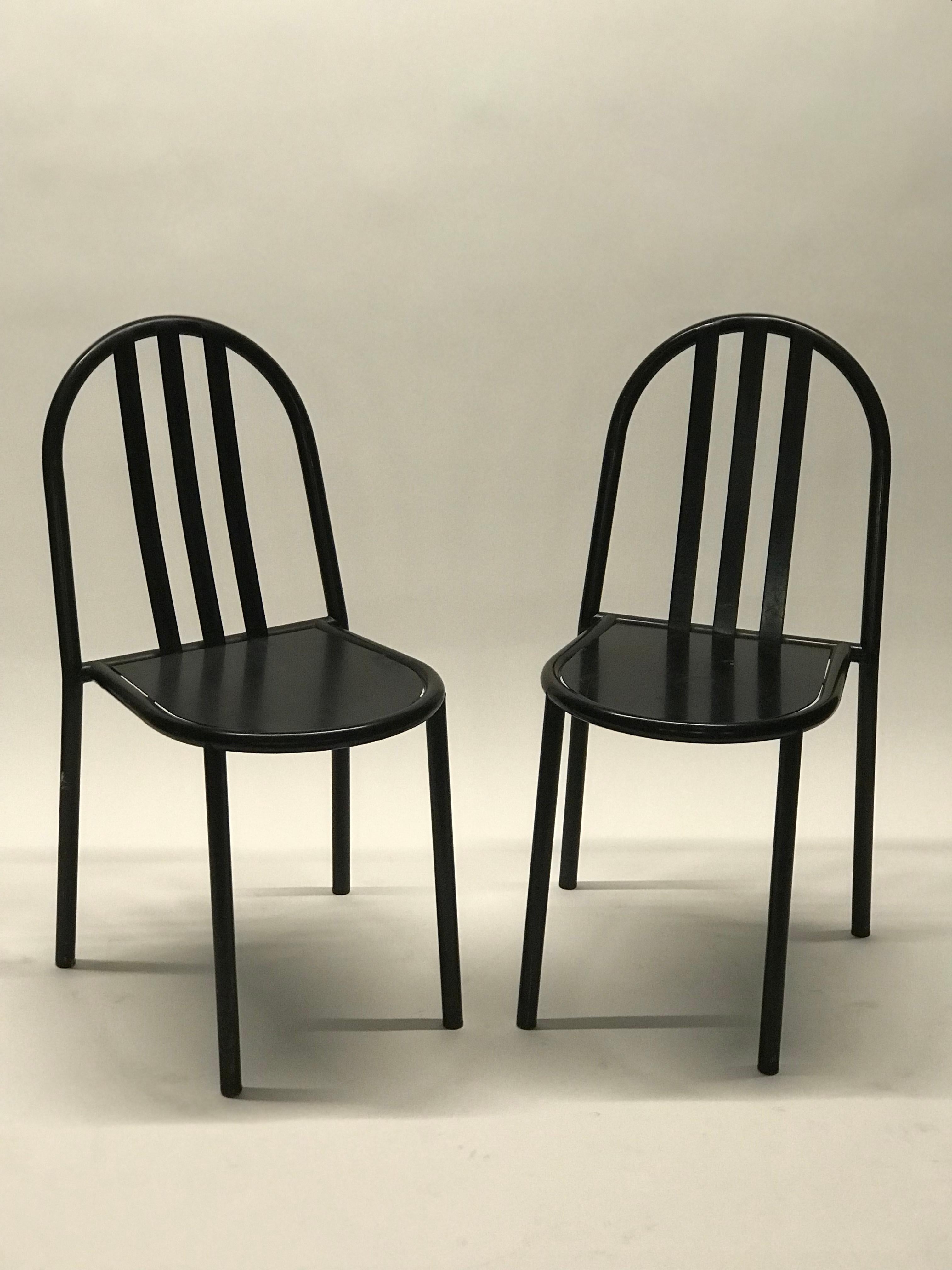 A pair of 1980's edition Robert Mallet Stevens No. 222 Stacking Chairs in vintage original black gloss finish. In excellent functional and structural condition the chair shows signs of wear associated with age and use, there are chips to the finish