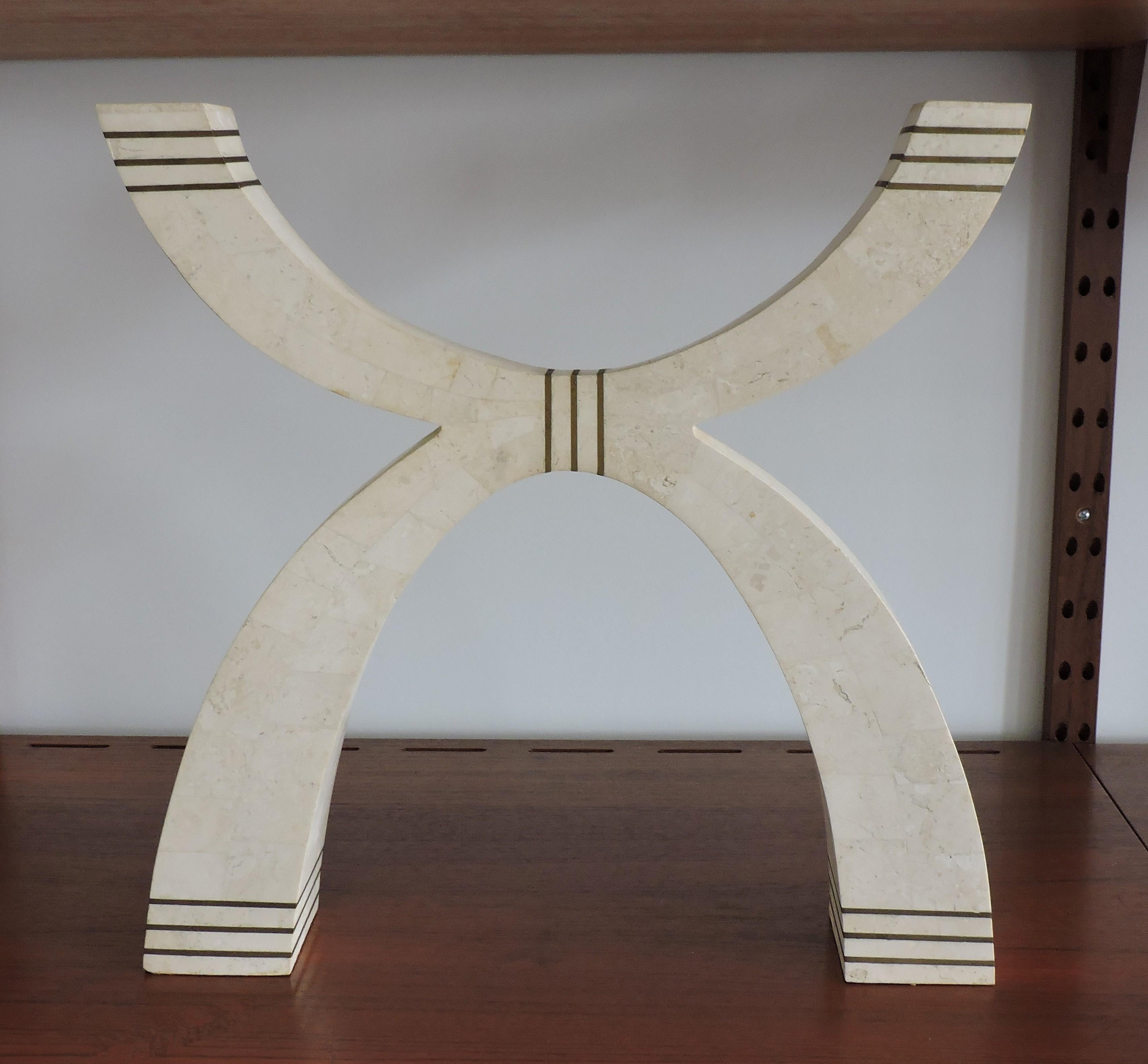 Large and striking sculptural candleholder designed by Robert Marcius and manufactured by Casa Bique. This has a dramatic double arched form and is made of light beige tessellated stone with brass inlay details. Accepts two candles.
