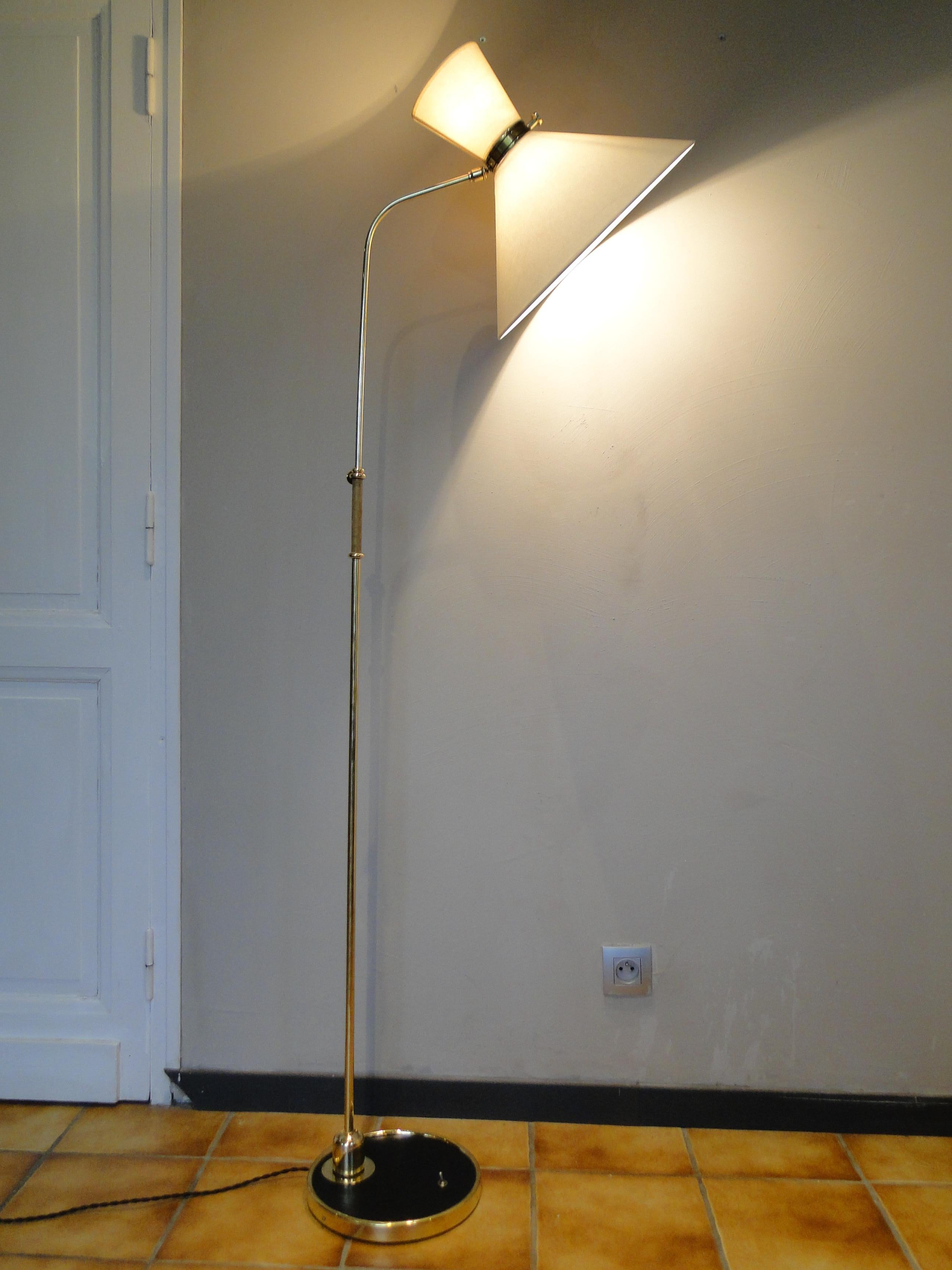 French Maison Lunel articulating floor lamp in brass

 Articulating shade and shaft rotates 360, can achieve very dramatic angles in any direction forward, back, side to side.

 The shaft is mounted to a ball socket which allows full circular