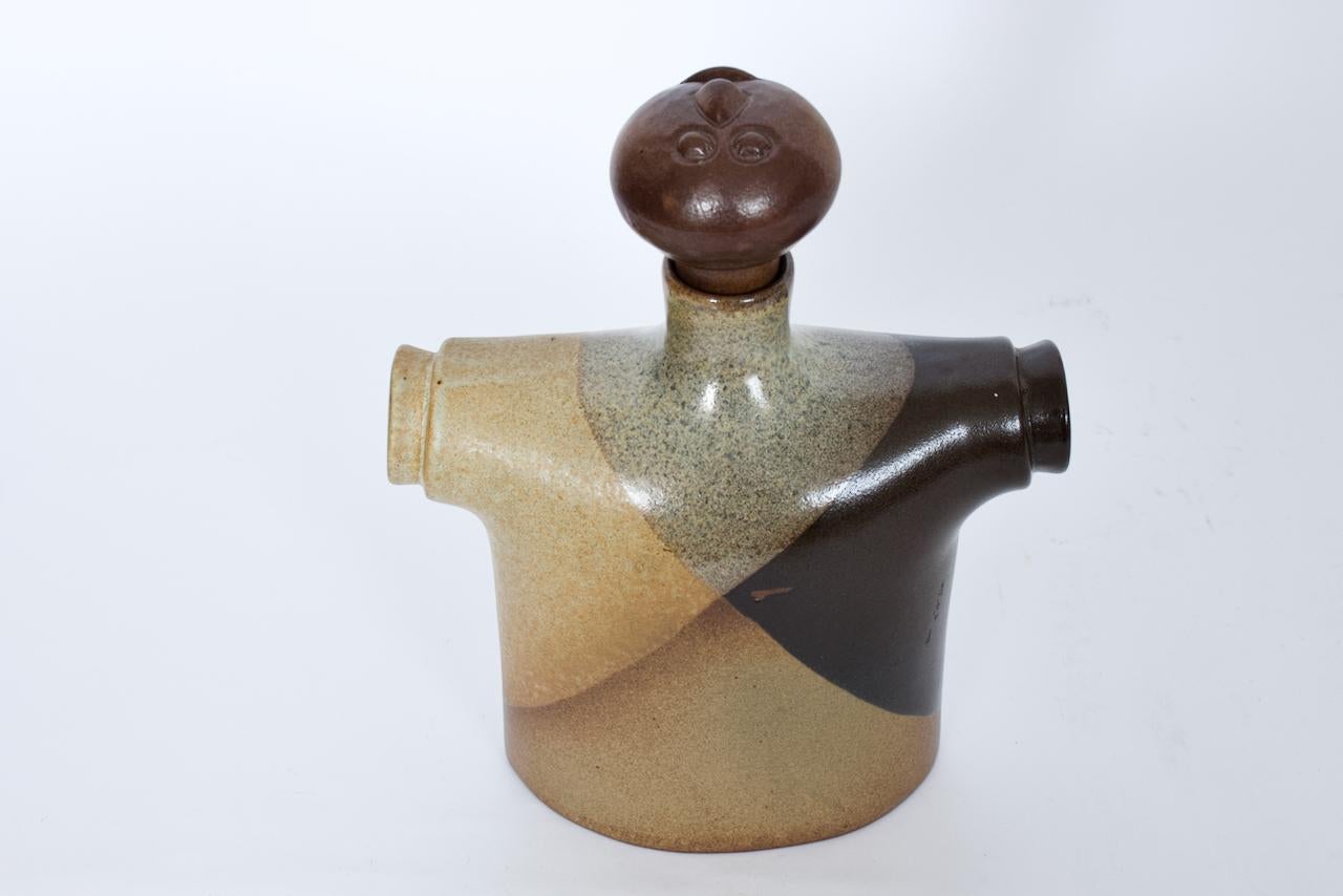 Large California Modern Robert Maxwell for Pottery Craft Ceramic Bottle.  Featuring a handcrafted two piece solid and speckled satin glazed pottery clothed female form facing upwards, outstretched arms, wearing a draped, patchwork garment in