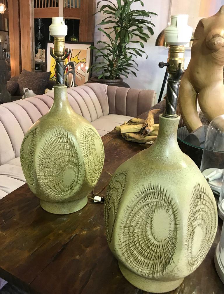 Pair of riveting, handmade lamps with classic incised sunburst pattern by iconic American/Californian potter Robert Maxwell. 

Exceptionally rare size and design. Both lamps are in pristine vintage condition. A fine and scarce example California