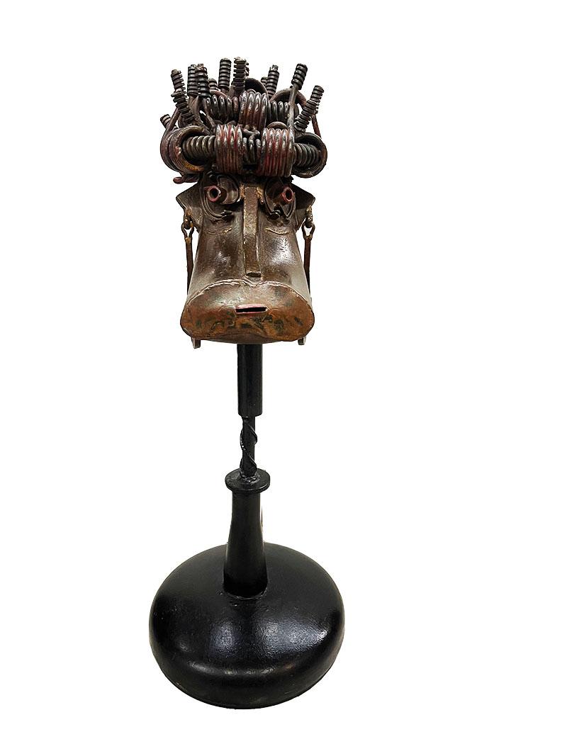 Robert Michiels (1933), iron sculpture

An iron sculpture in the shape of an animal head raised on a round base, made by Robert Michiels, Belgium, signed. In 1966 Robert received the Jeune Sculpture Belgium prize, the following year the Hainaut