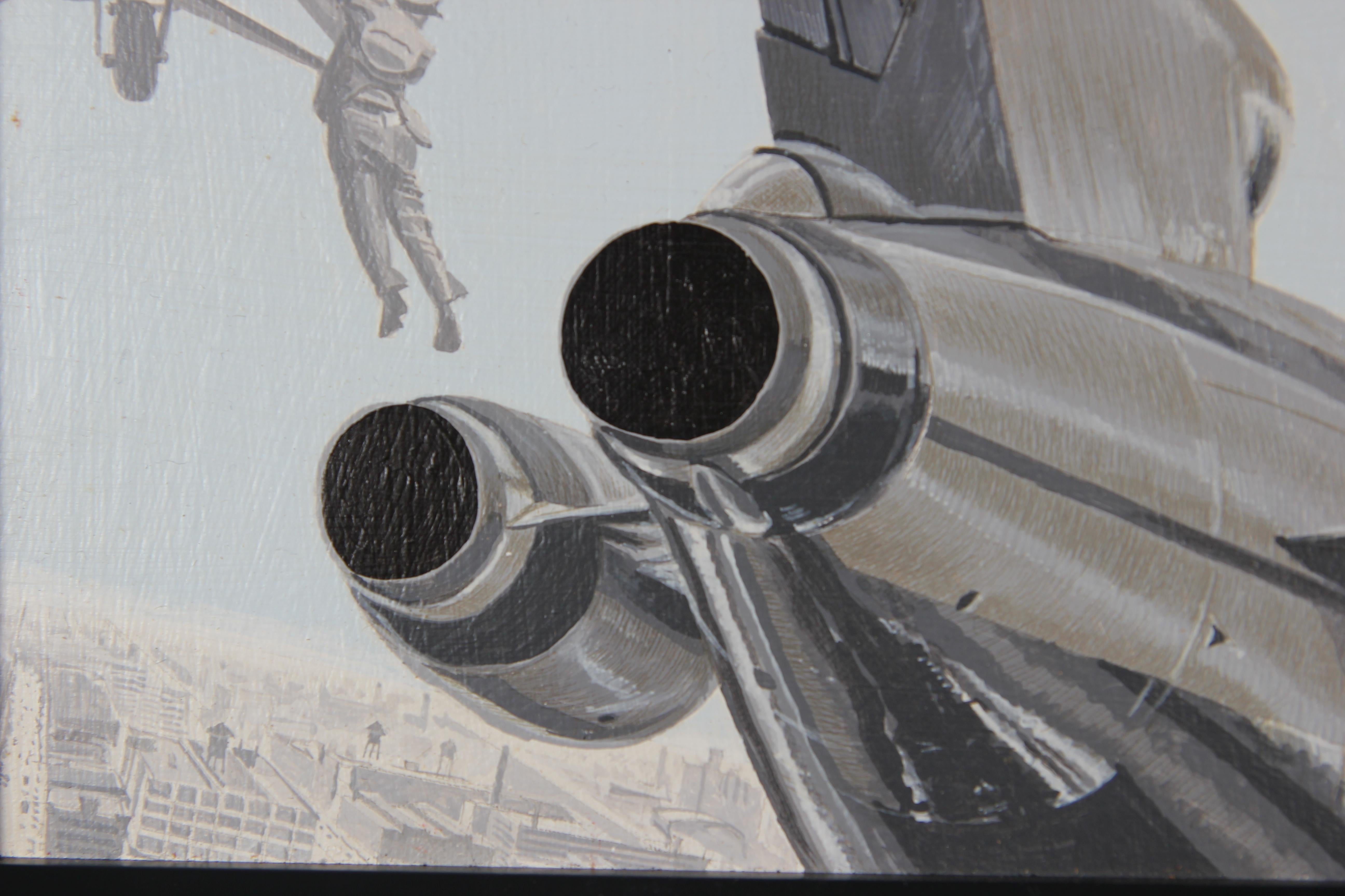 Surrealist painting of a close up of a tail of an airplane. In the background, there is a man hanging off a helicopter. Below the scene is a birds-eye view of a city. The work is signed, titled and dated by the artist. The board is framed in a black