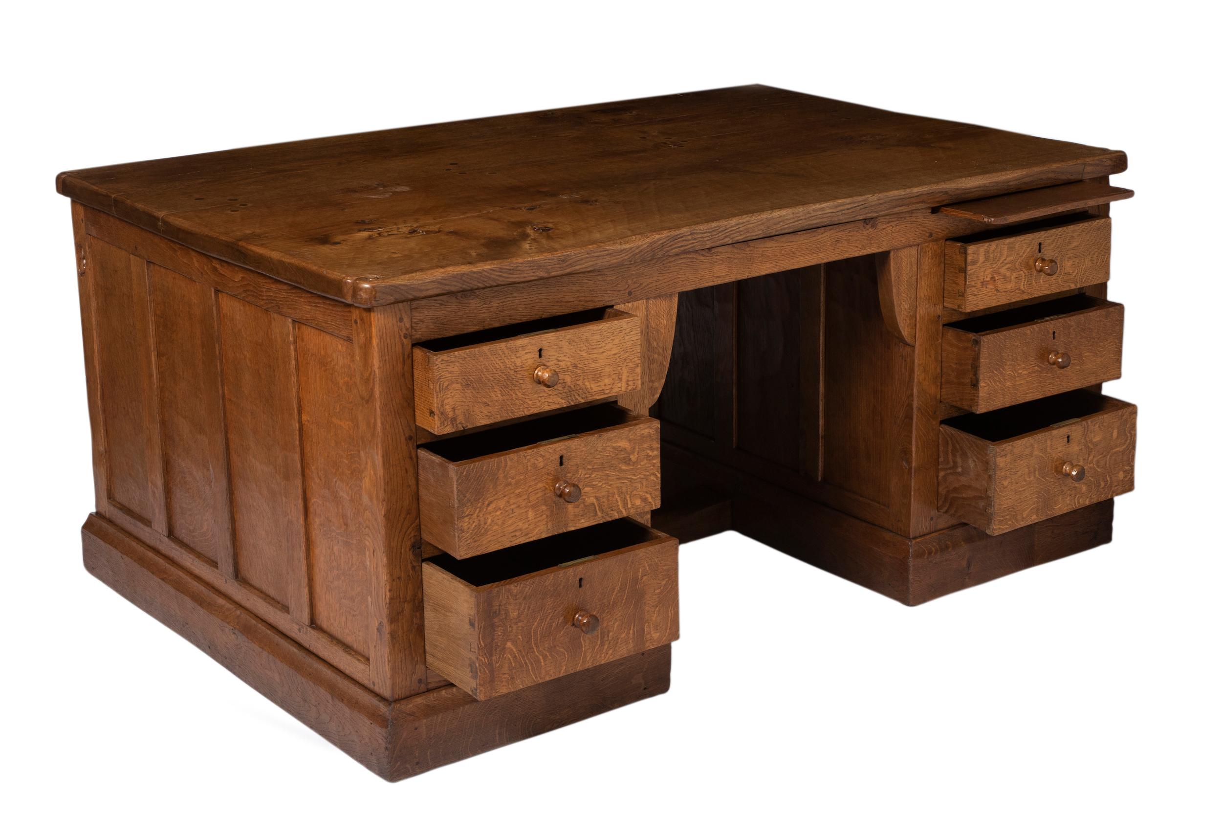 Robert Mouseman Thompson oak partners desk.
Adzed top with scrolled corners.
With a slide and 3 drawers either side of the knee hole. The opposite side
With 2 cupboards.
Inscribed “lll” underneath and mouse signature to the corner.
Robert