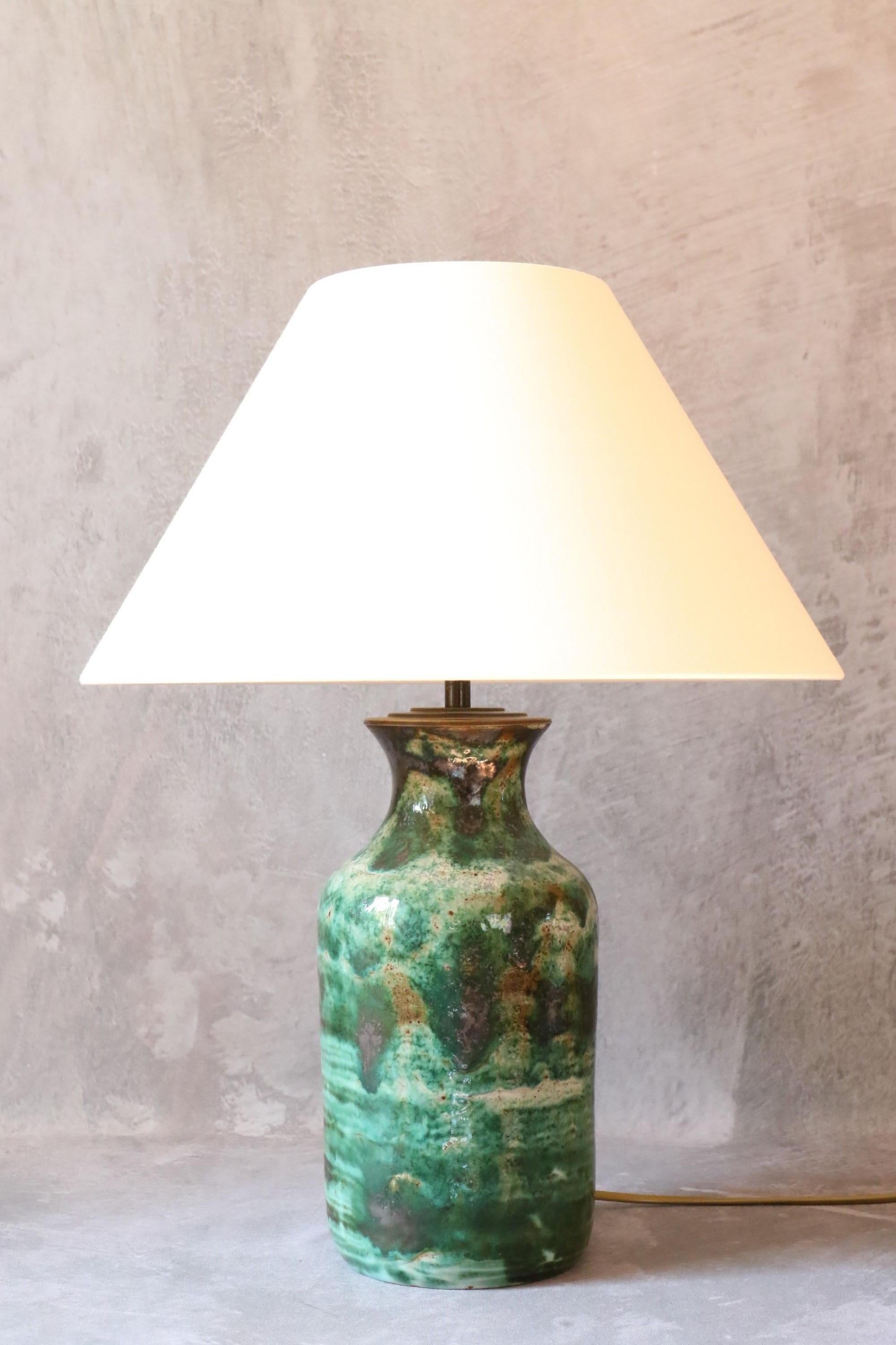 Robert Picault, High Ceramic Lamp, Signed, Vallauris, France, 1950s

Stunning ceramic table lamp by Robert Picault. The glaze tones are typical of Picault's work.
In very good condition. 
Signed and inscribed 