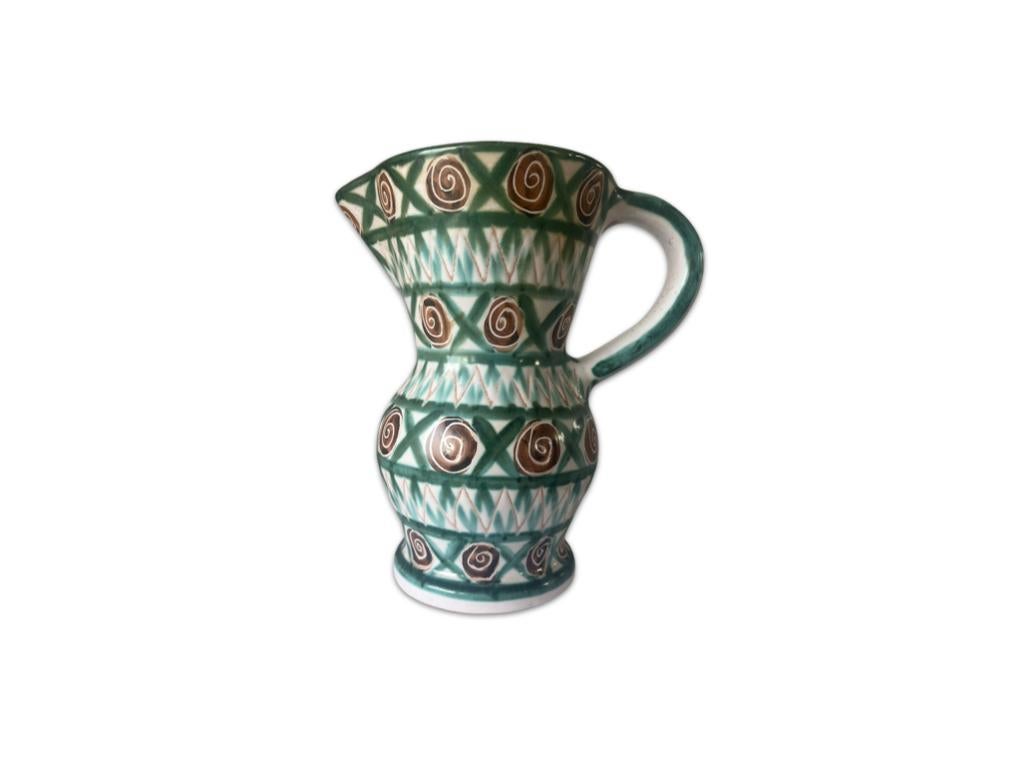 Offered for sale a magnificent handmade large pitcher by Robert Picault

In superb condition designed in his very regocnisable style in a green, white and brown geometric design. This mid-cemtury vase from the south of France is a wonderful