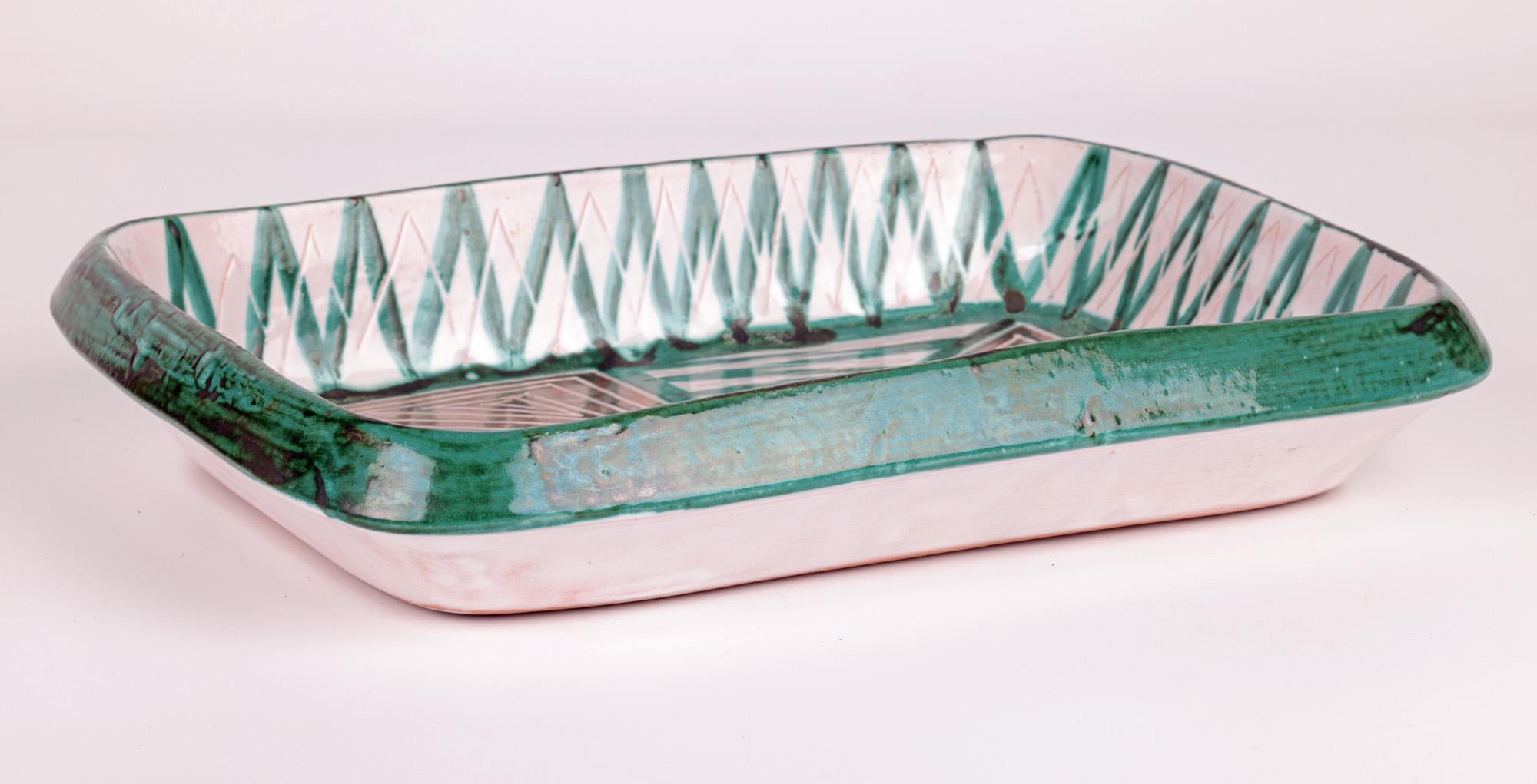 A rare and important stunning French mid-century art pottery serving dish by Robert Picault and made in Vallauris in the South of France. Working closely to Picasso this dish hand made in red clay is of rectangular shaped and  is hand decorated with