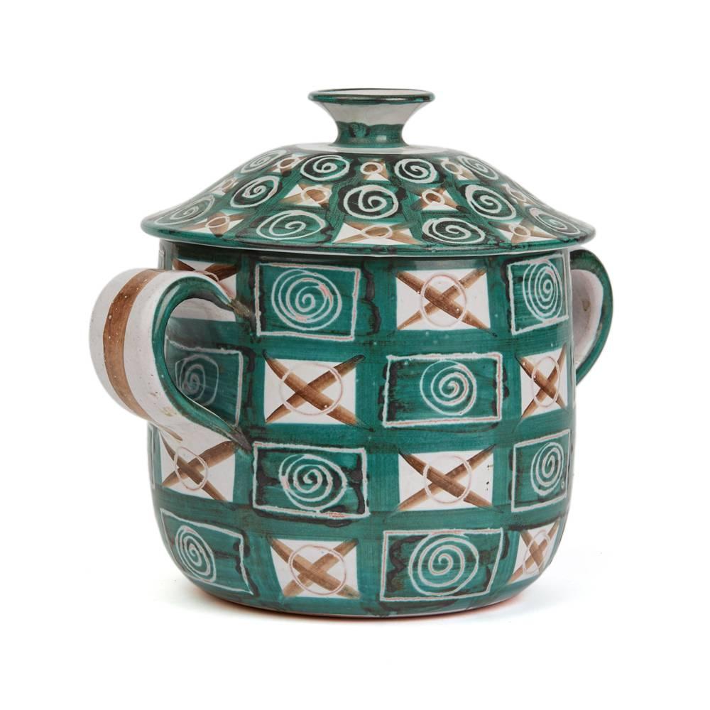 A rare and important stunning French art pottery lidded twin handled soup tureen by Robert Picault and made in Vallauris in the South of France. Working closely to Picasso each piece is hand decorated with green, brown and incised patterned designs.