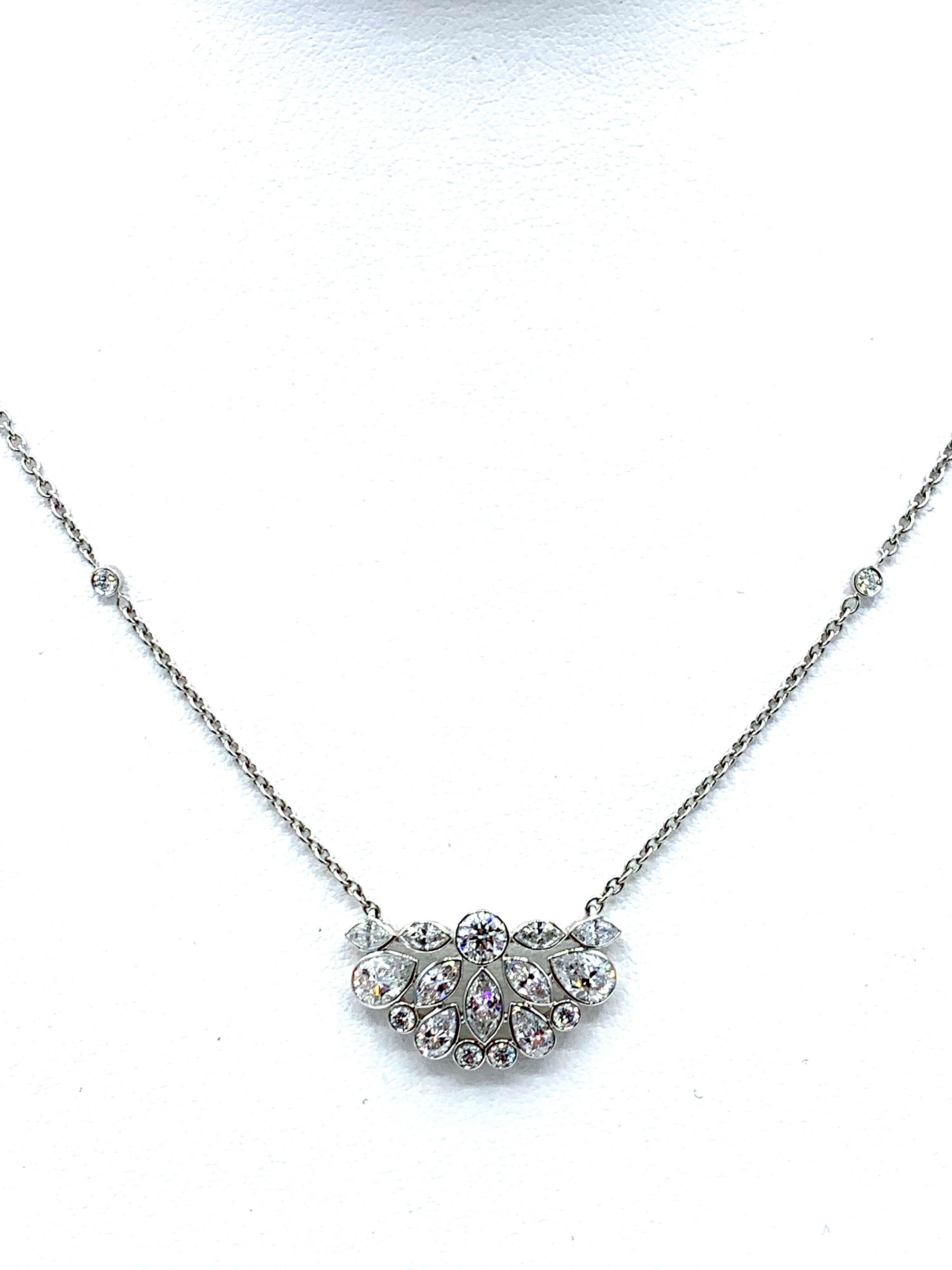 An absolutely gorgeous Robert Procop De La Vie Collection Diamond cluster pendant! The pendant necklace is handcrafted in platinum with beautifully cut Diamonds. There are 26 various shaped white Diamonds weighing 2.31 carats make up this easy to