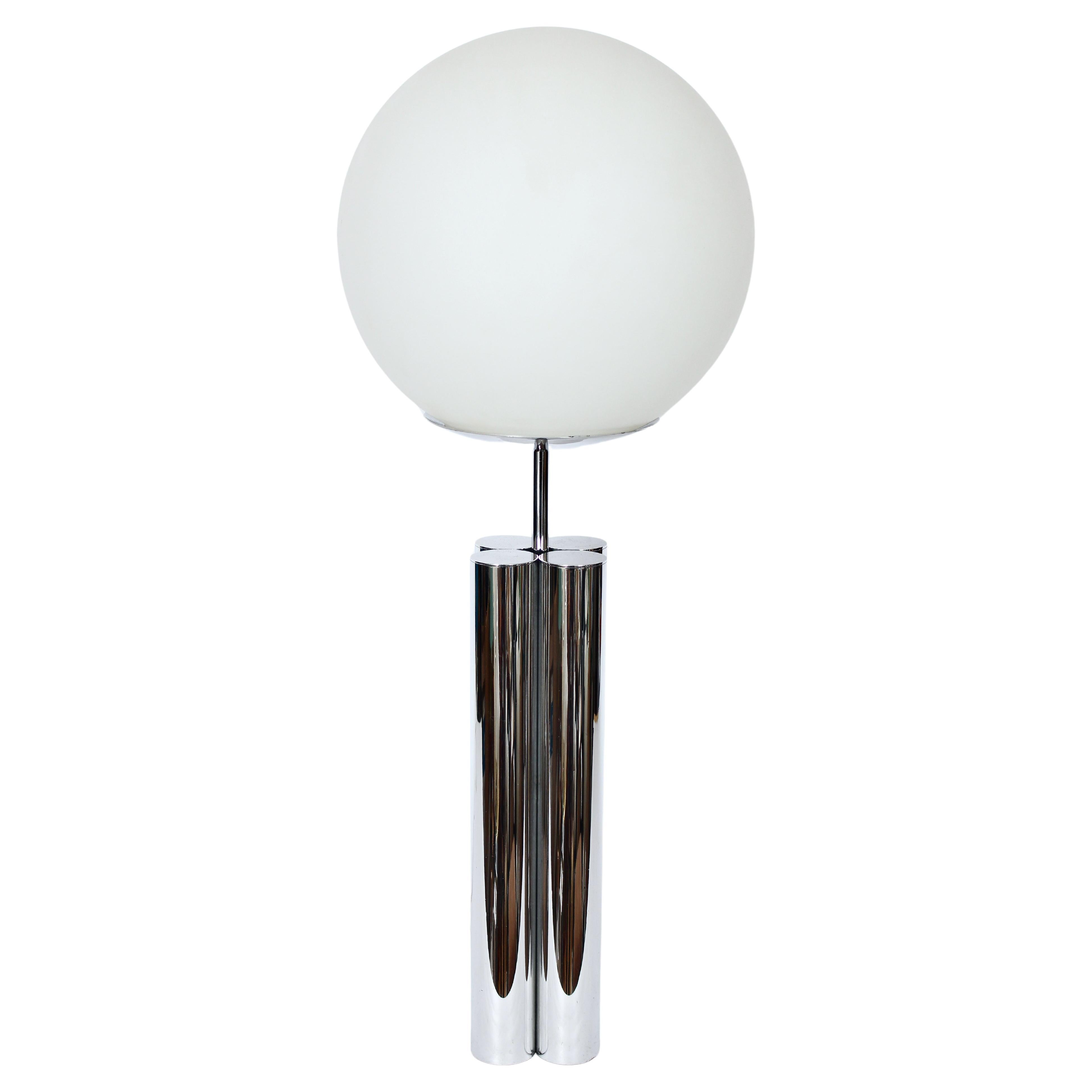 Tall Robert Sonneman for George Kovacs attributed Four Column Table Lamp with White Frosted Glass Globe.  Featuring a four capped tubular balanced, repolished, reflective Aluminum rod lamp base (4W x 4D)  (Rods 2D each), circular dish shade platform