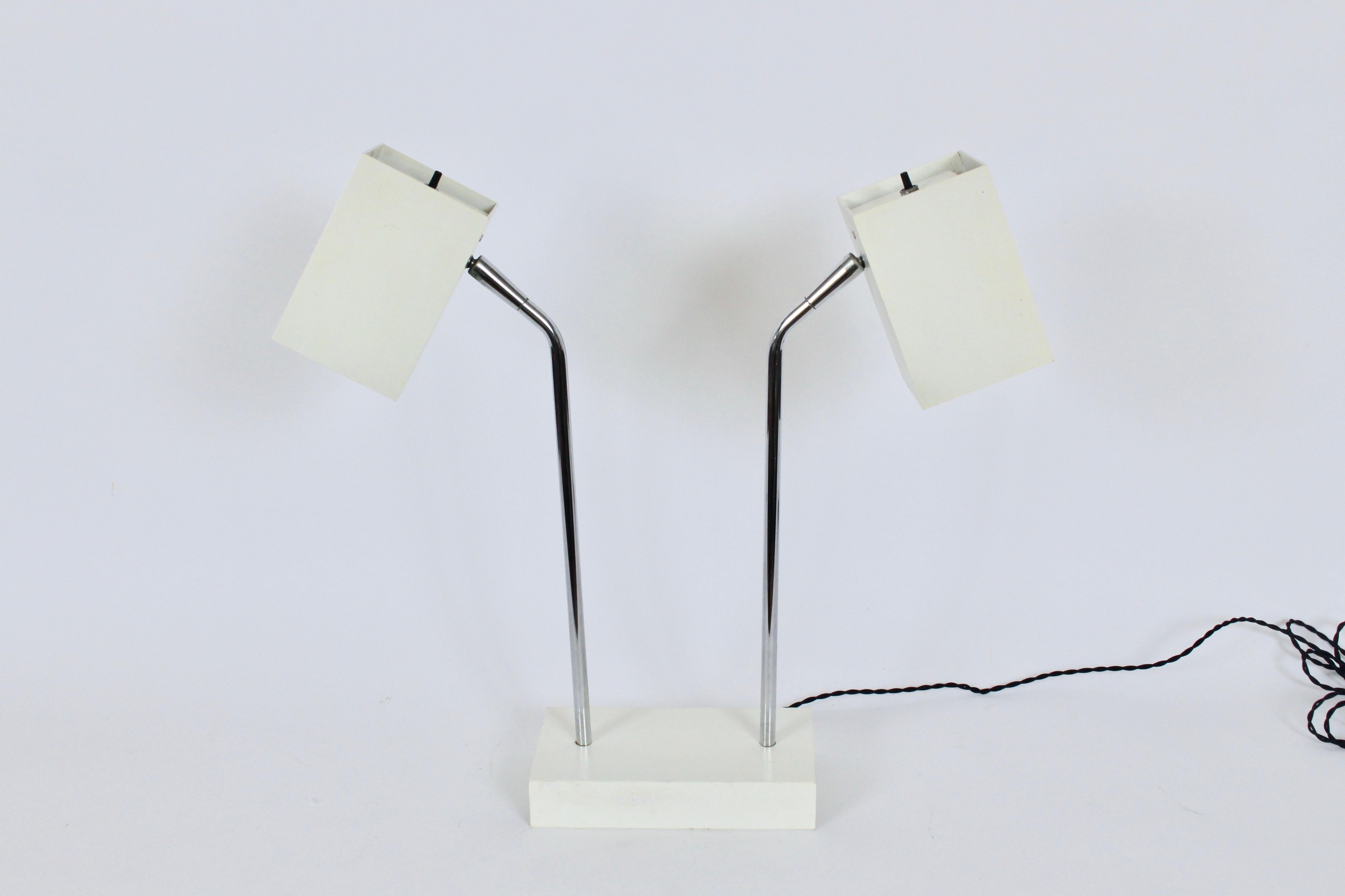 Robert Sonneman for George Kovacs enameled off white metal double box head table lamp.  Featuring angled chrome arms, cubed enameled adjustable, rotating and pivoting off white enameled metal heads, atop a rectangular, off white enameled steel base