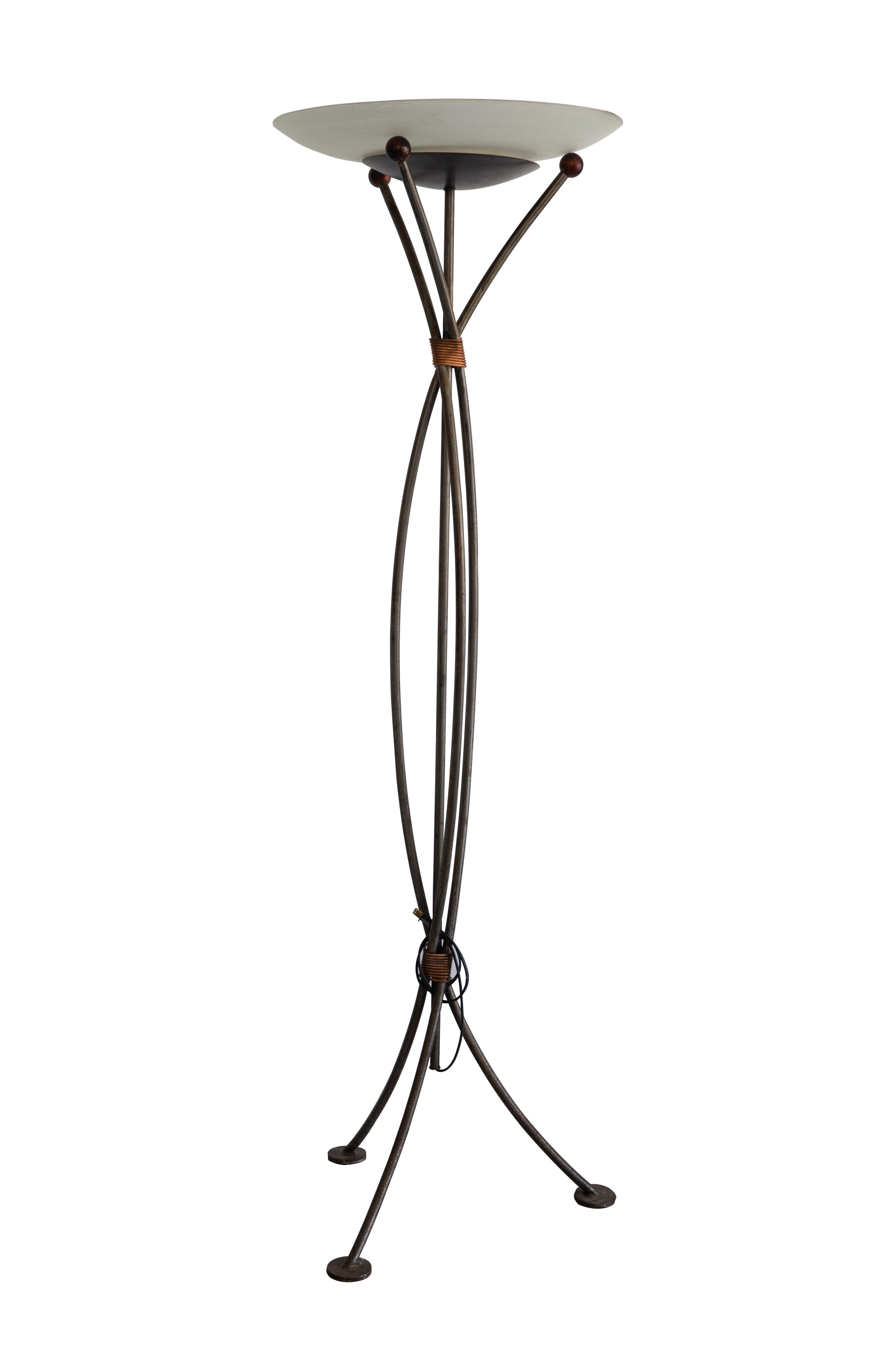 Offered is a rare tripod based torchier wrought iron with copper accents and etched glass shade by Robert Sonneman for George Kovacs. The piece has two identification labels, one for George Kovacs and another that credits the 1990 copyright to