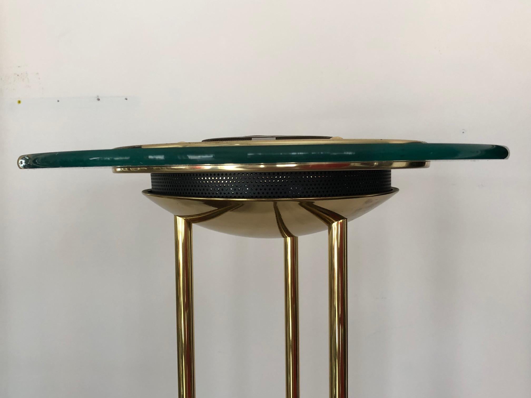 An interesting floor lamp designed by Robert Sonneman for George Kovacs, circa 1987. Very well made with polished brass, marble base, green tinted glass reflector. Comes with a foot switch.