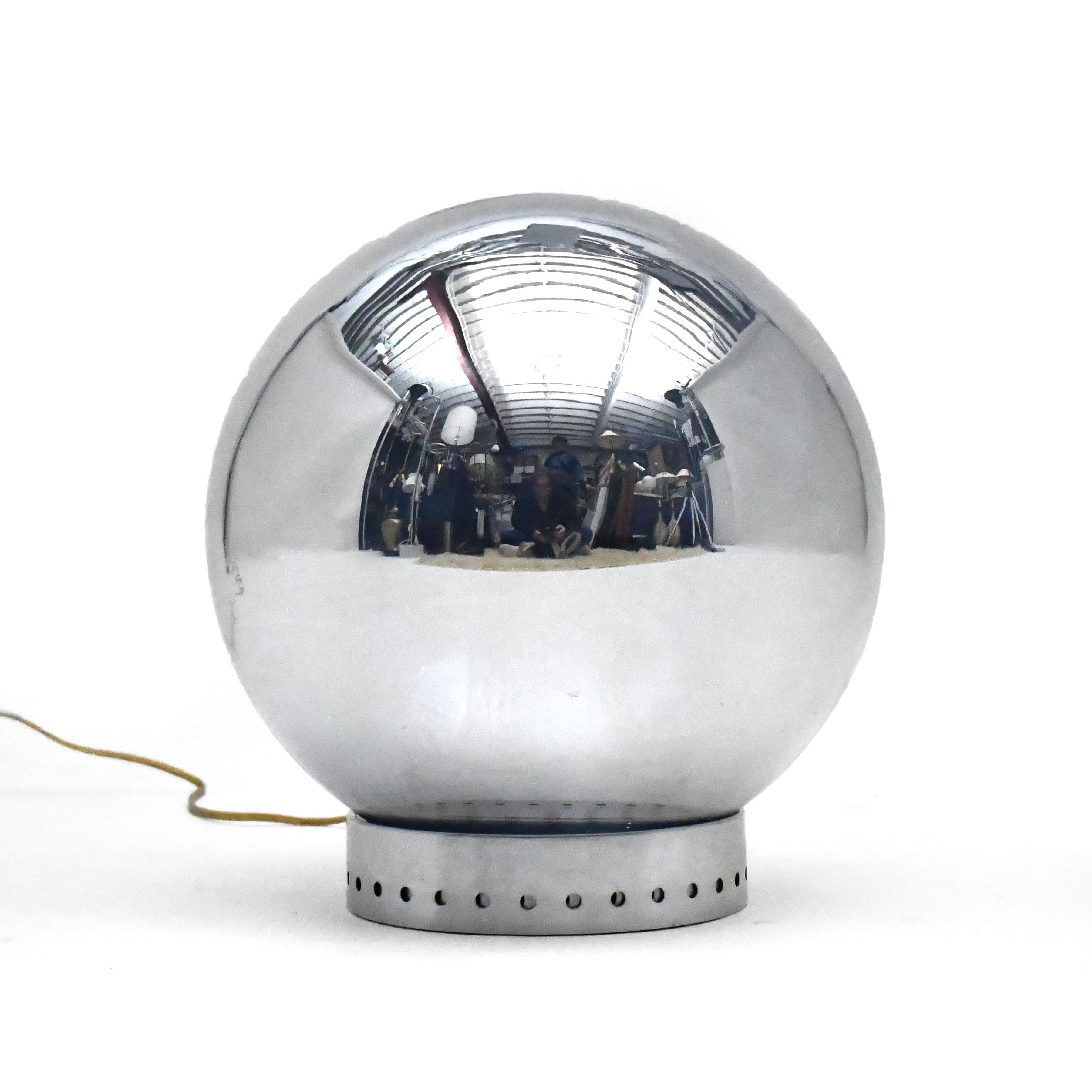 A rare and important design by famous lighting designer Robert Sonneman, this wildly innovative table lamp uses one-way mirror and touch-lamp technology to create a striking minimalist form. The glass sphere appears to be a chrome ball when off, but