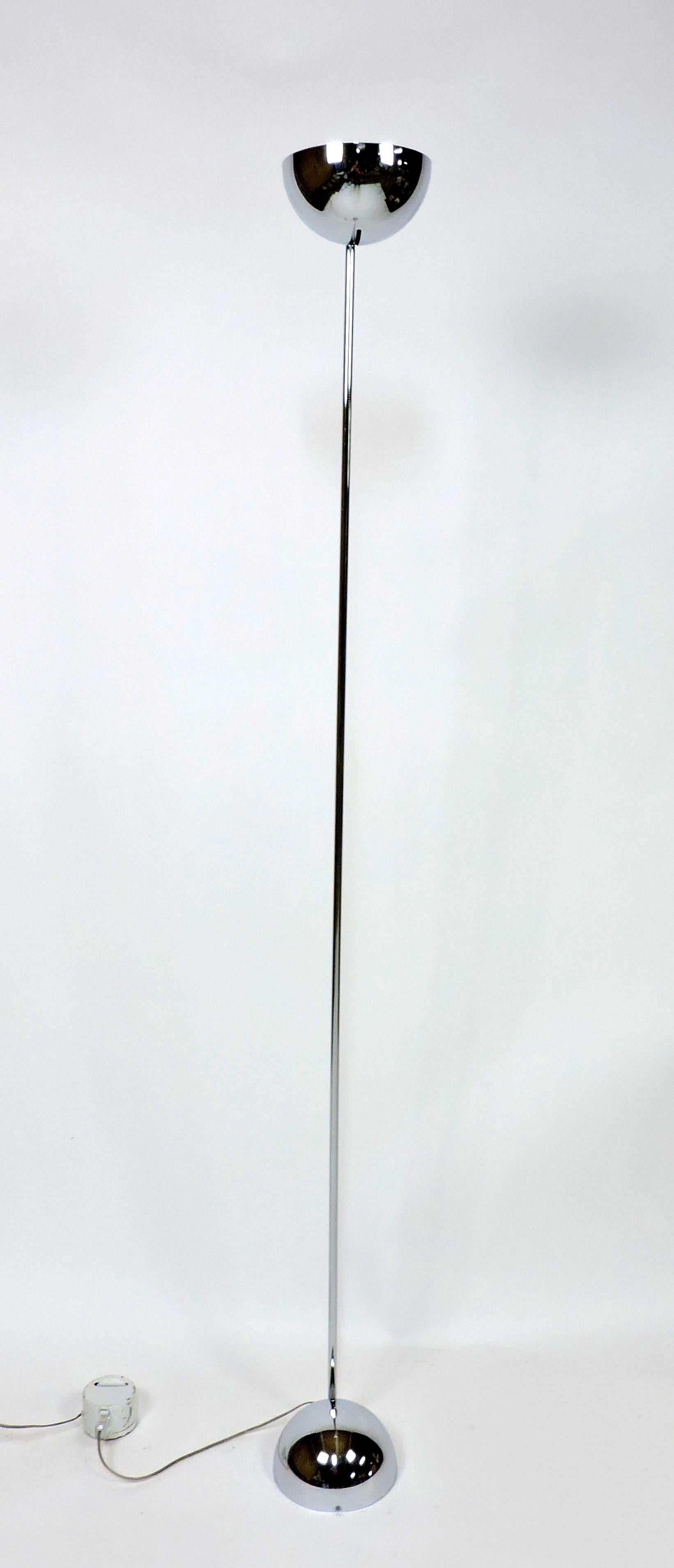 This beautiful and minimalist floor lamp was designed by Robert Sonneman and manufactured by Kovacs. The lamp is made of high-quality chrome and is heavy and well-made. It consists of two half-spheres, one at the top and one at the bottom, connected