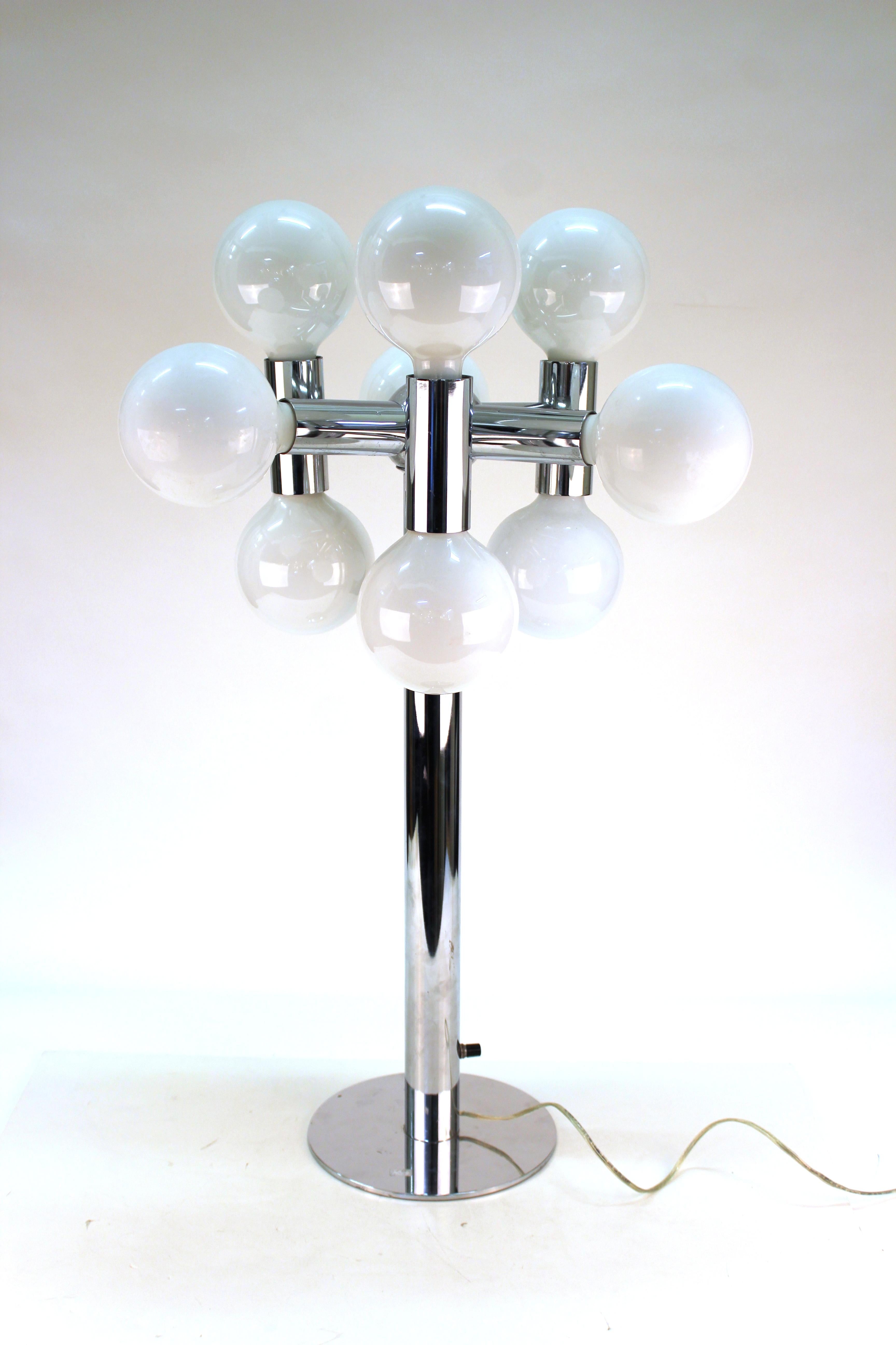 Molecular polished chrome table lamp made by Robert Sonneman in the 1970s. The piece has nine large bulb lights disposed in molecular style around a central base shaft. The piece is in great vintage condition, with some minor age appropriate wear to