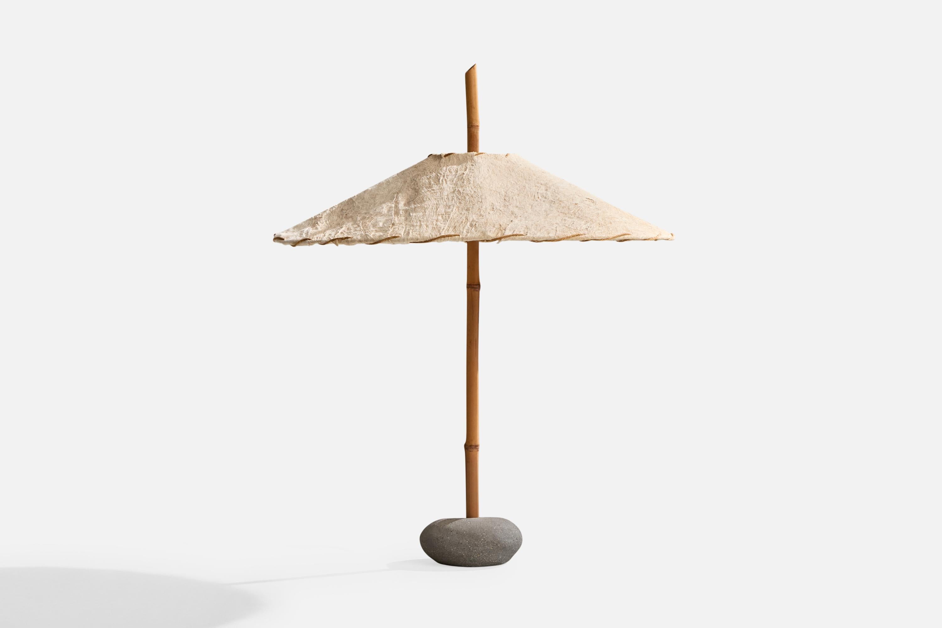 A bamboo, stone and beige paper table lamp designed by Robert Sonneman and produced by George Kovacs, USA, c. 1990.

Dimensions of Lamp with Shade (inches): 31.4” H x 25.3” Diameter

Bulb Specifications: E-26 Bulb

Number of Sockets (per fixture):
