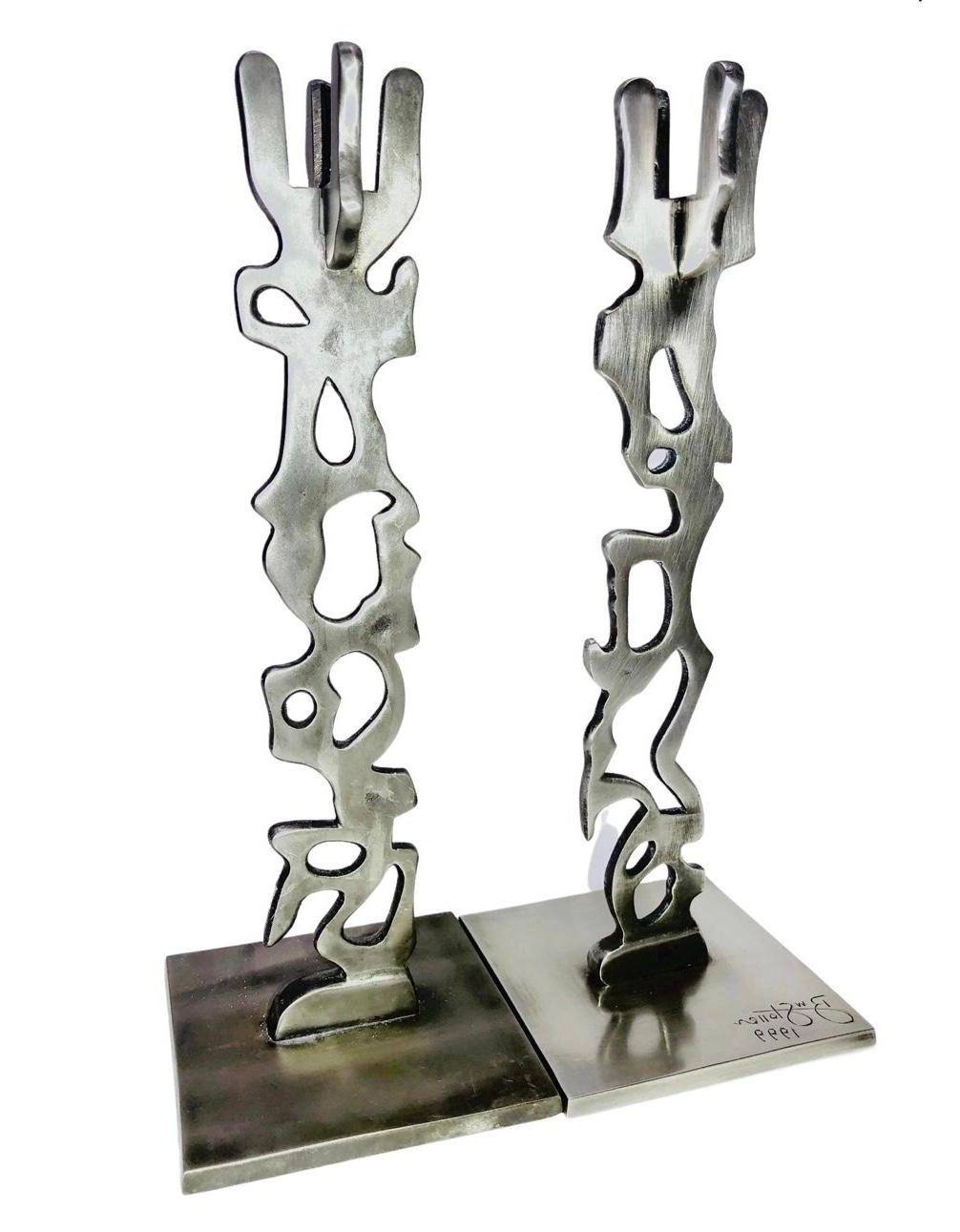 One of a Kind, hand wrought, industrial, aluminum, pair of modernist, sculptural, Matisse styled, signed and dated candleholders by American sculptor R. W. Stoller 

One holder is hand etched within the artist's signature and dated 1999. 

Stoller,