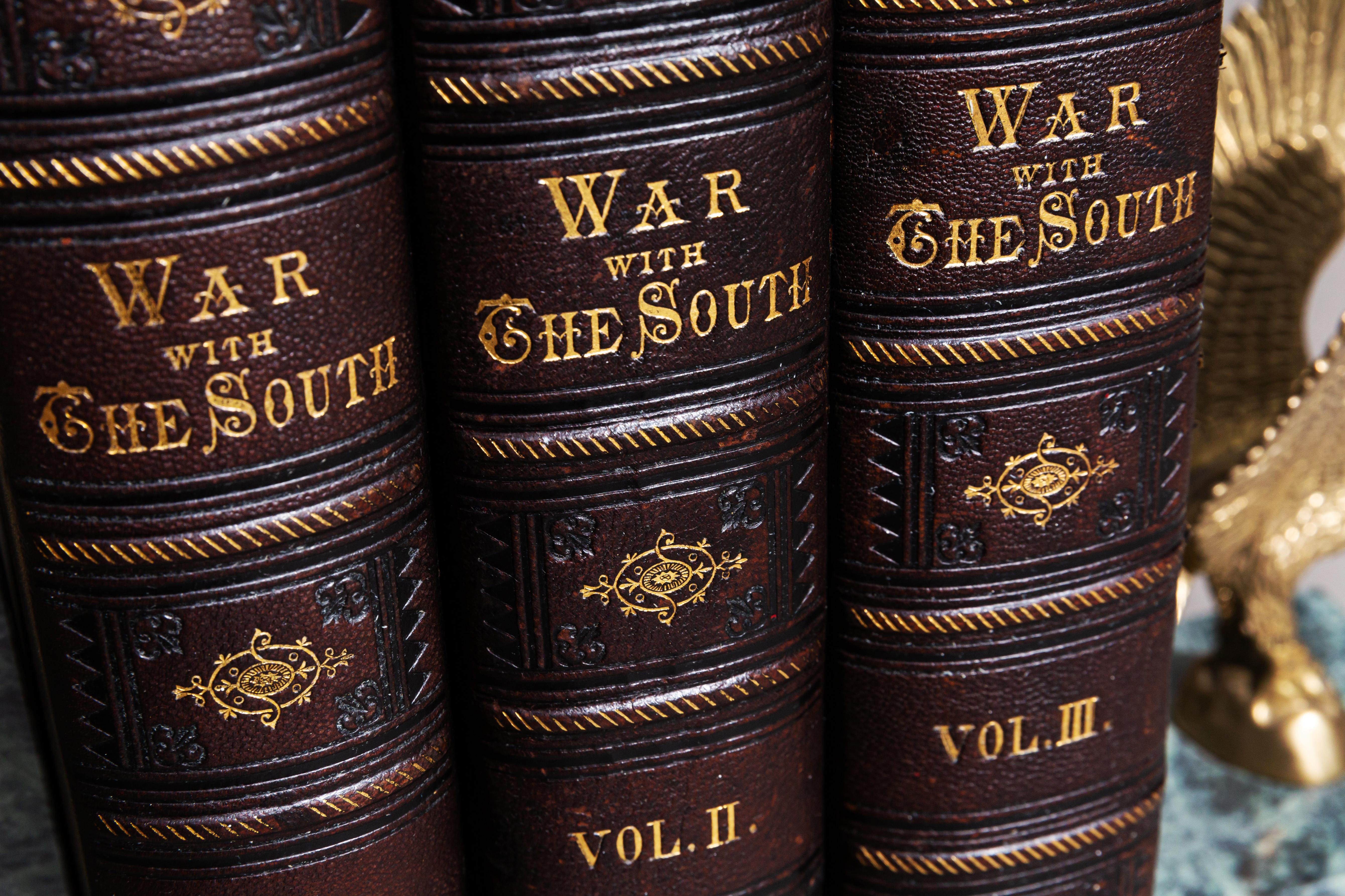 The War With The South. A History of The Late Rebellion. With
Biographical Sketches of Leading Statesmen, and Distinguished Naval, Military Commanders
etc.

Bound in 3/4 brown Morocco, cloth boards, all edges gilt, raised bands, gilt on