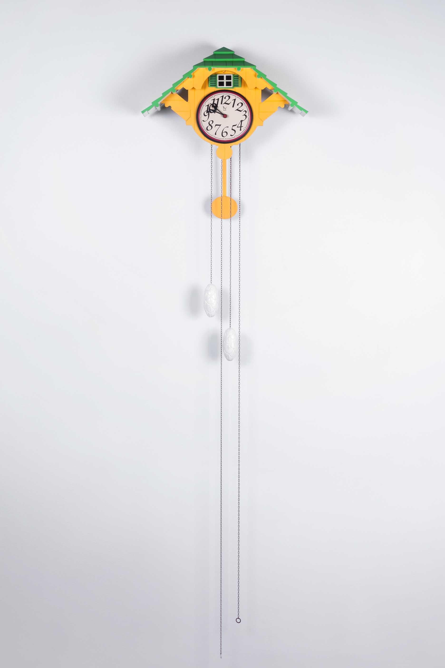 Brilliant yellow and green colors that pop in this postmodern cuckoo clock by Robert Venturi for Alesia, made in Italy in 1988.

A bellows operated cuckoo melody plays at the turn of every hour, a little door opening to reveal a minimal steel
