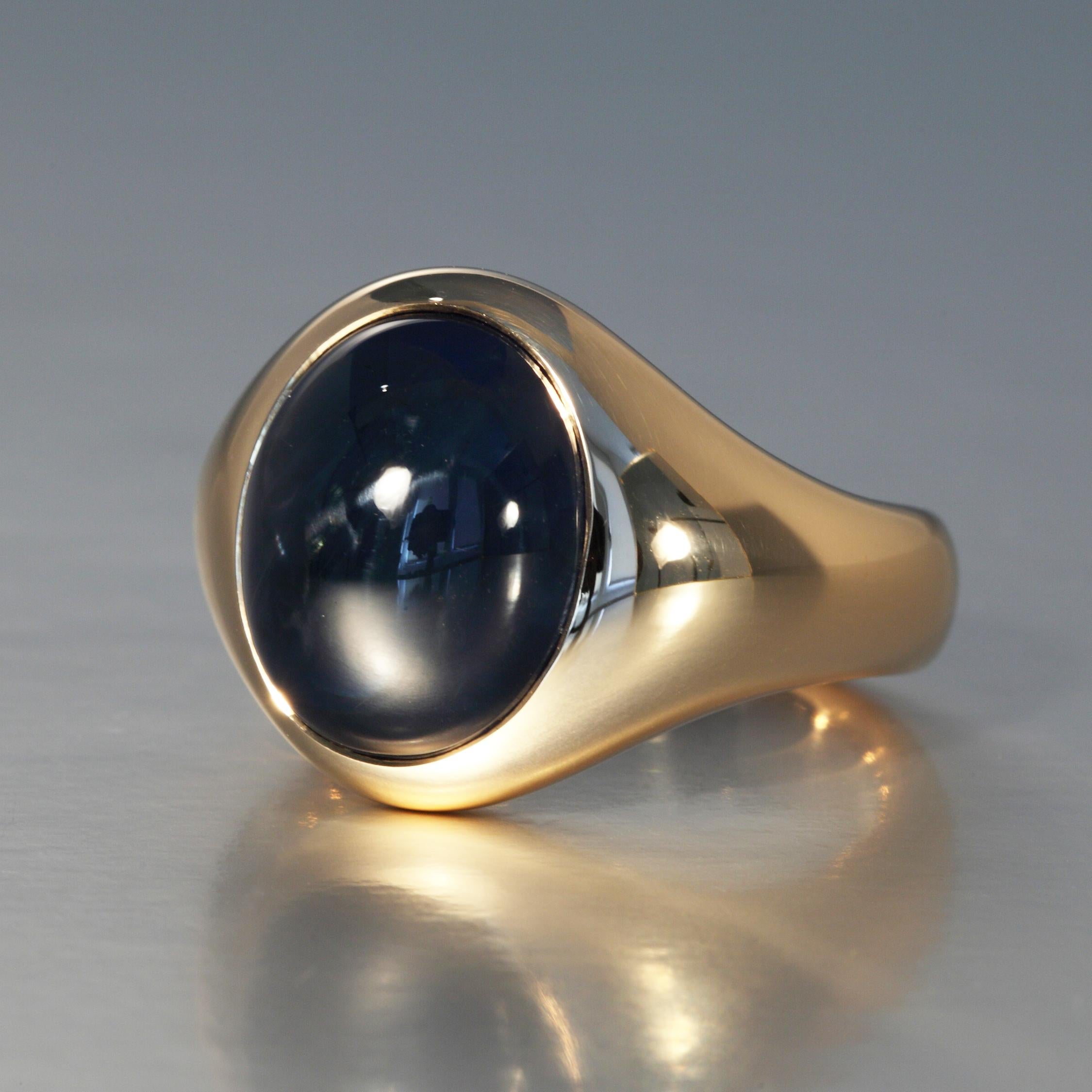 The 13.22 carat oval cabochon cut blue sapphire is mounted in a rose gold ring. This one of a kind piece is designed and hand made (lost wax method) in Zurich, Switzerland by Robert Vogelsang and signed RV.

It is set in 18 Karat rose gold and