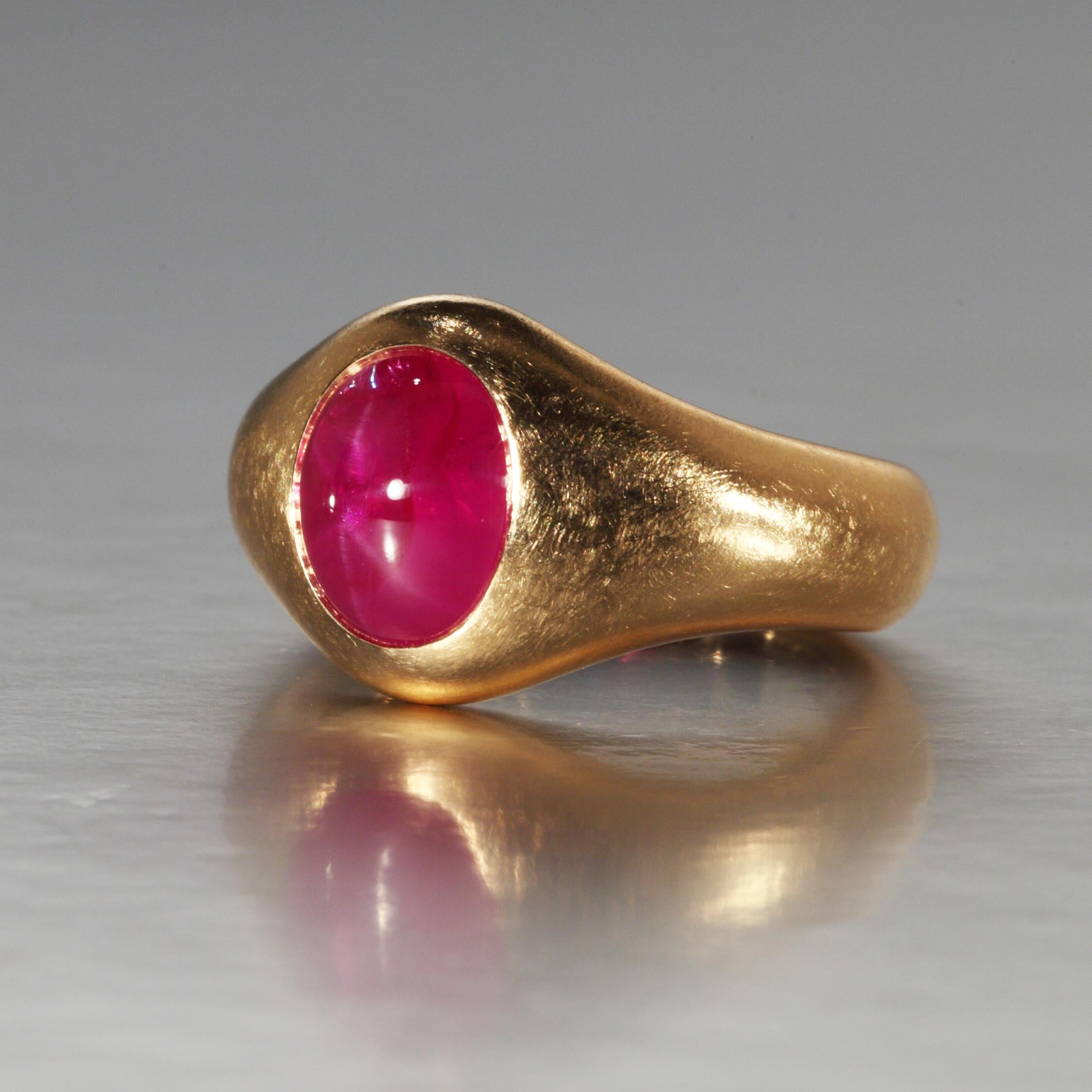 This fine natural Burma star ruby of 6.03 carats is set in a rose gold ring. An inner white gold spring moves easily over the knuckle and holds the ring in place. The ruby is accompanied by a GRS Report. It is designed and hand made (lost wax